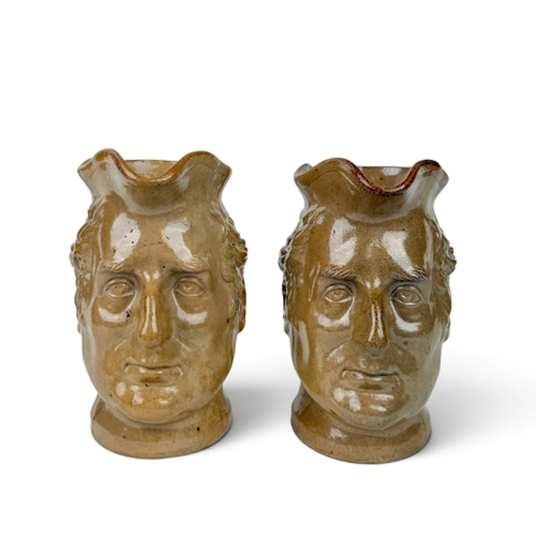 A PAIR OF ENGLISH STONEWARE CHARACTER JUGS DEPICTING THE DUK...
