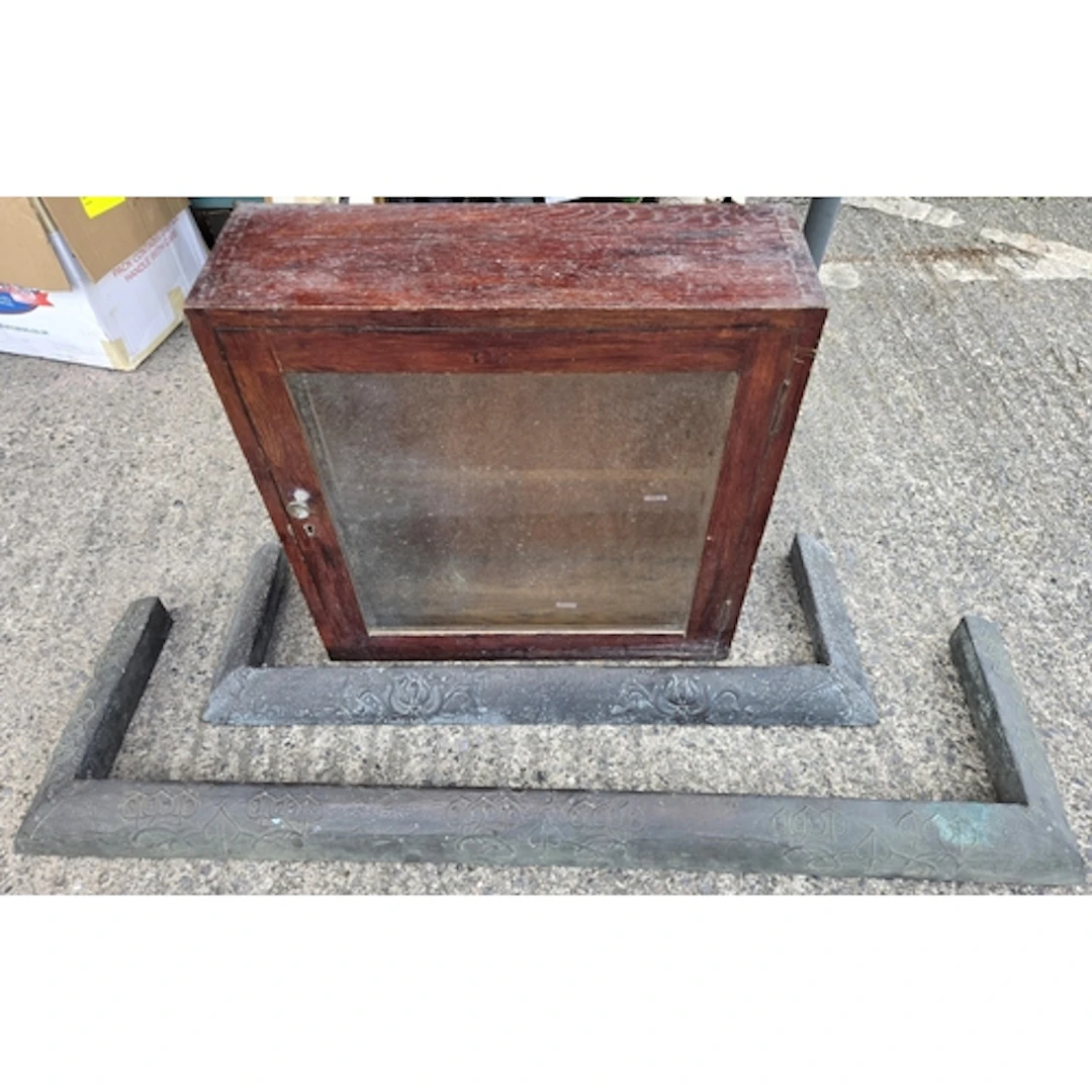 An Art Nouveau copper beaten and embossed fire surround with...