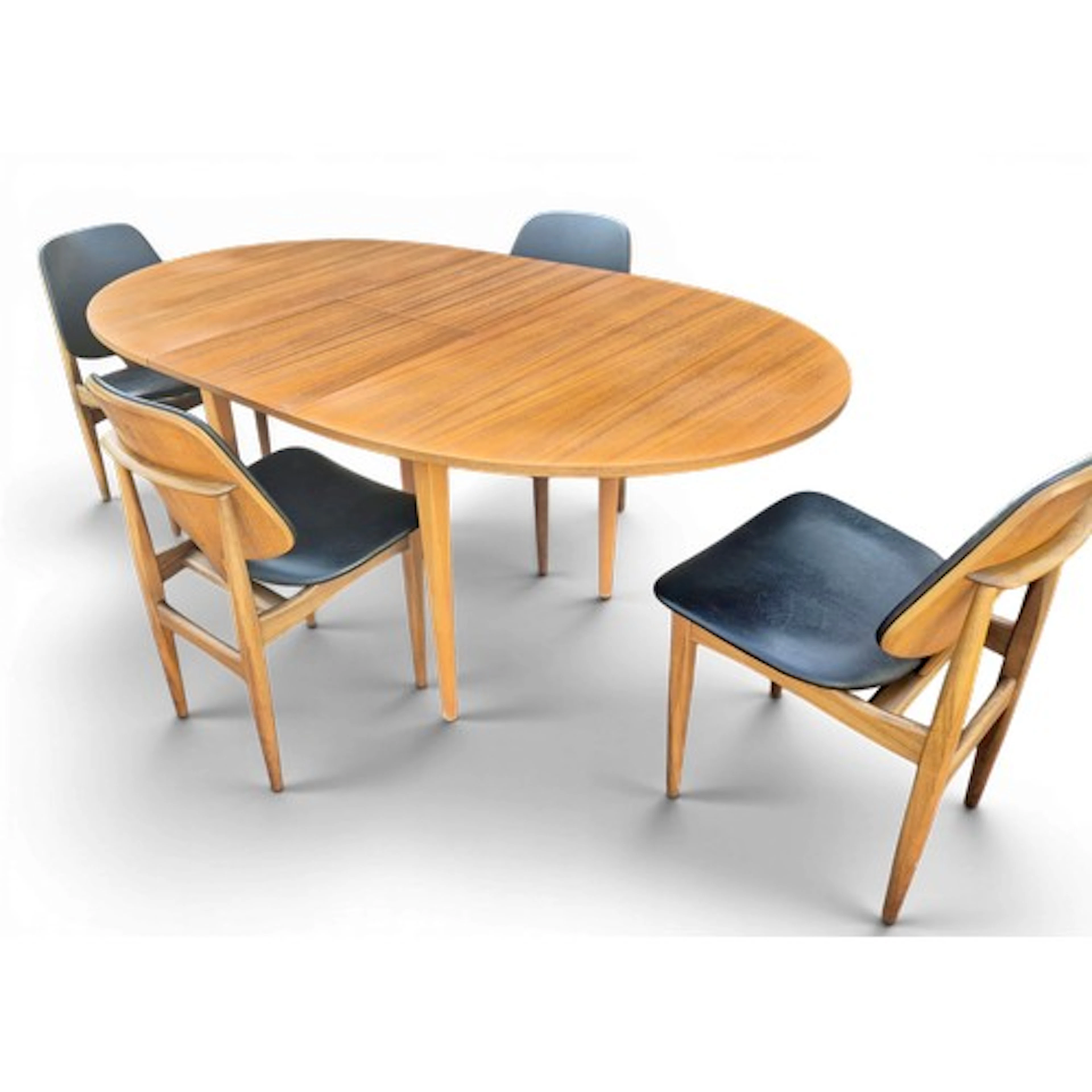 A mid 20thC extending dining table and four chairs with upho...
