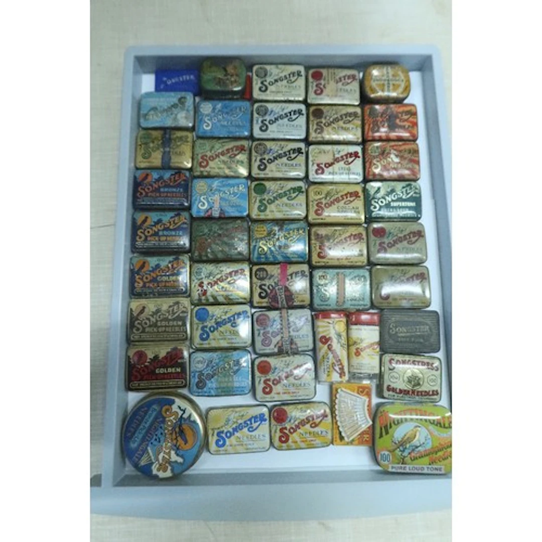 A tray of vintage gramphone needle tins