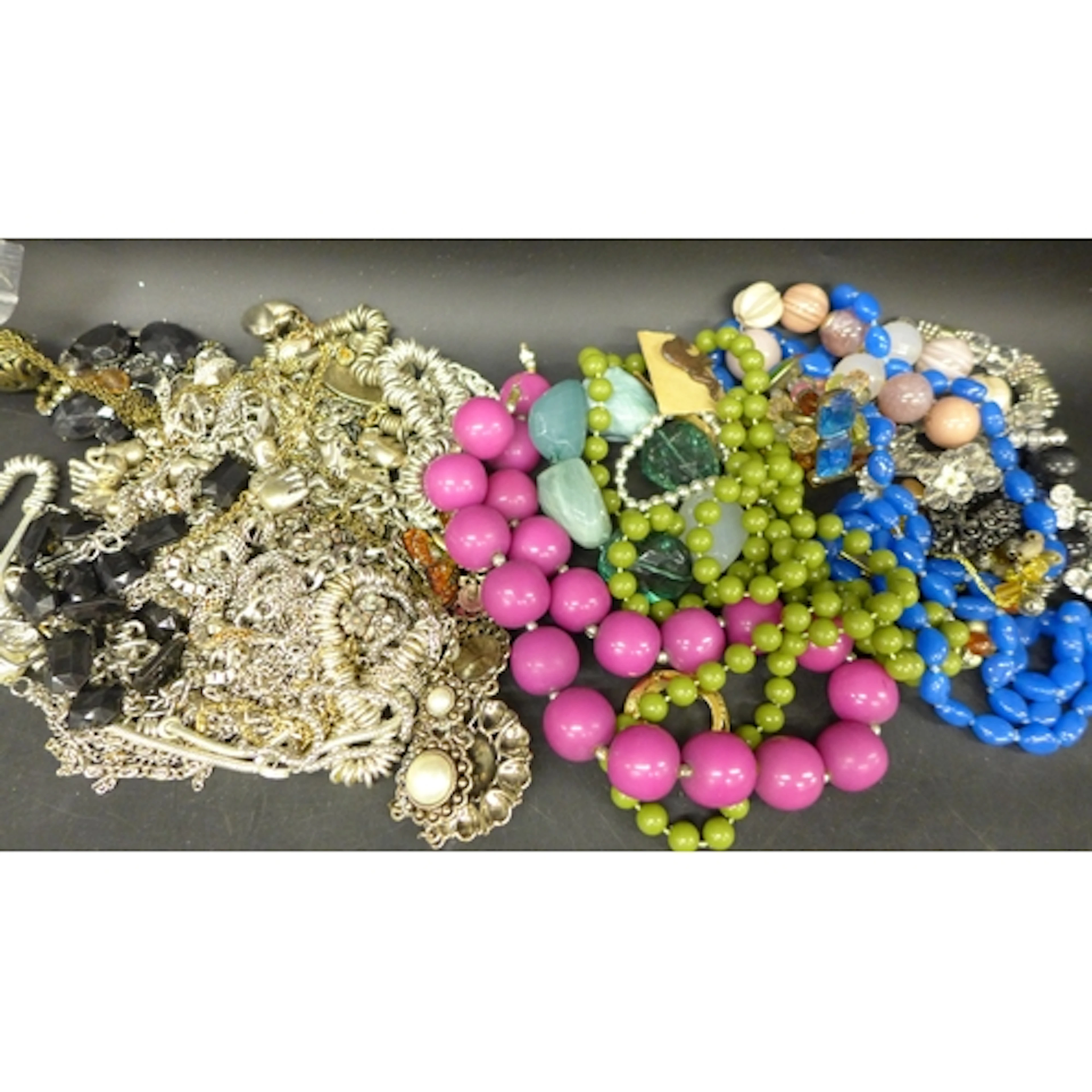 A collection of silver tone jewellery together with costume ...