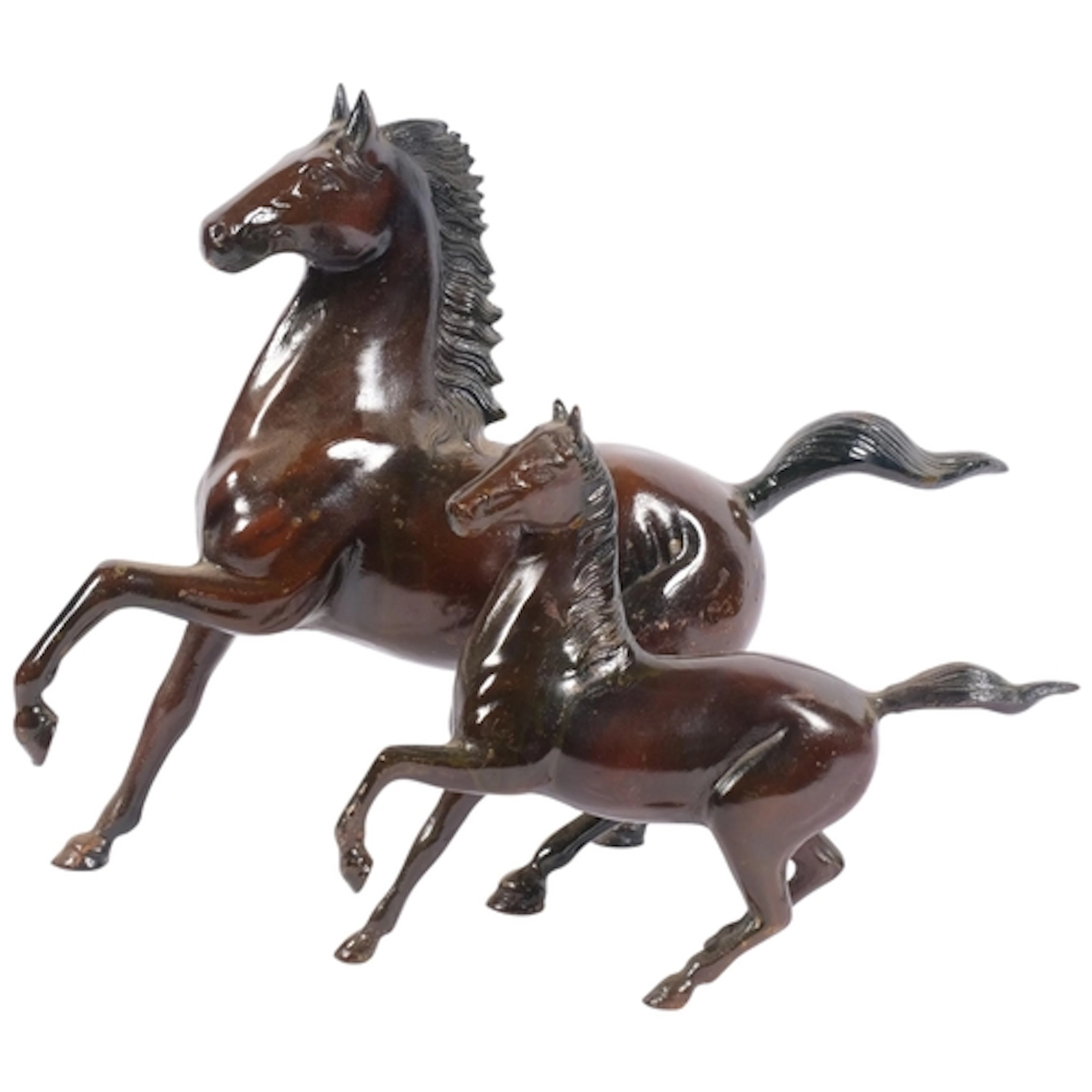 A graduated pair of Chinese cast-metal rearing horses, seal ...
