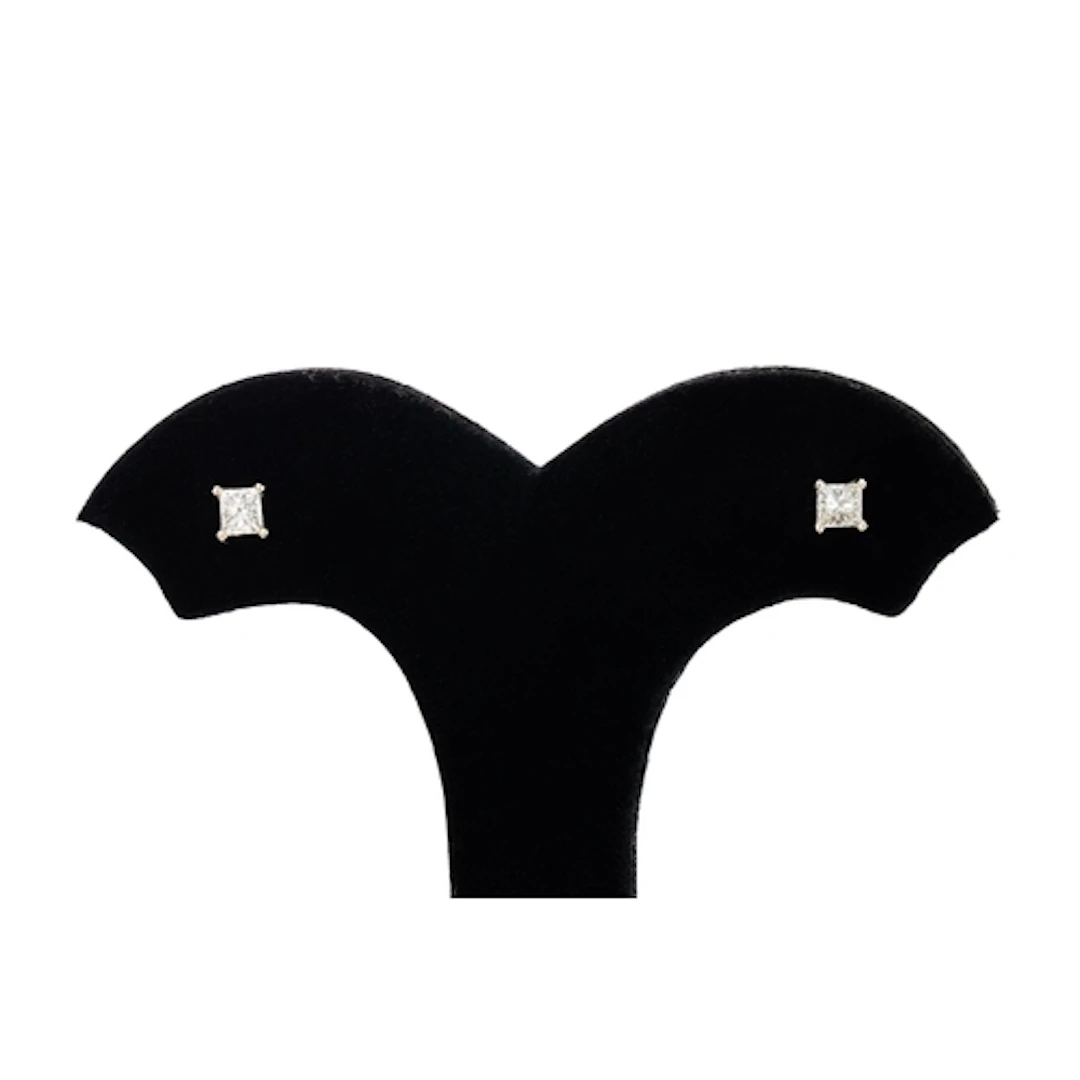 A PAIR OF PRINCESS CUT DIAMOND EARRINGS, mounted in 14ct whi...