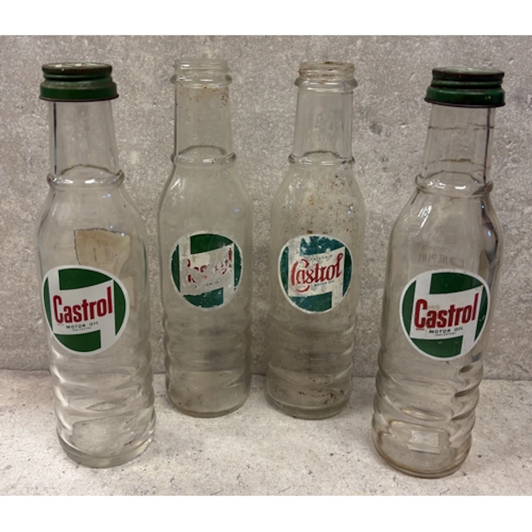 A collection of four one pint Castrol Motor Oil glass bottle...