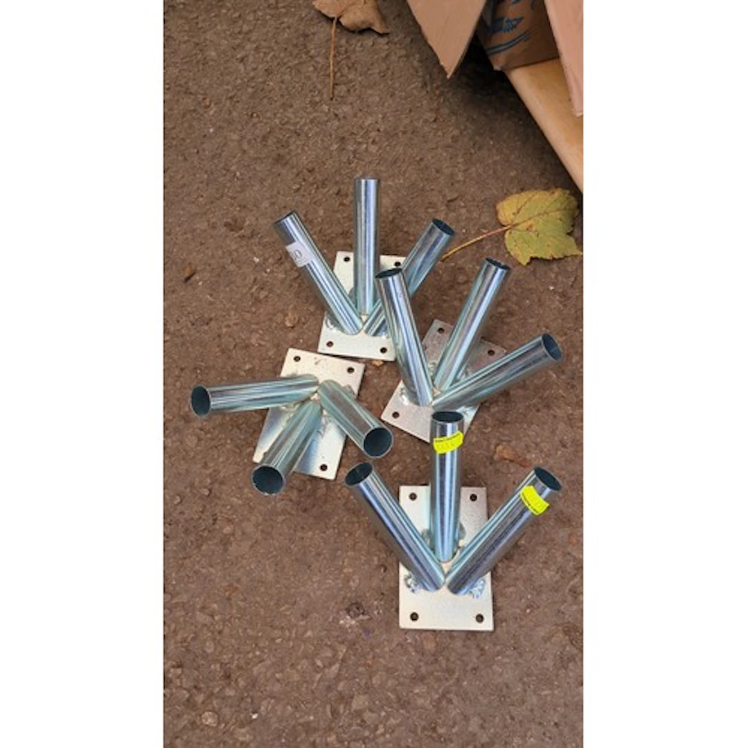 Four three-way galvanised steel flagpole brackets, each with...