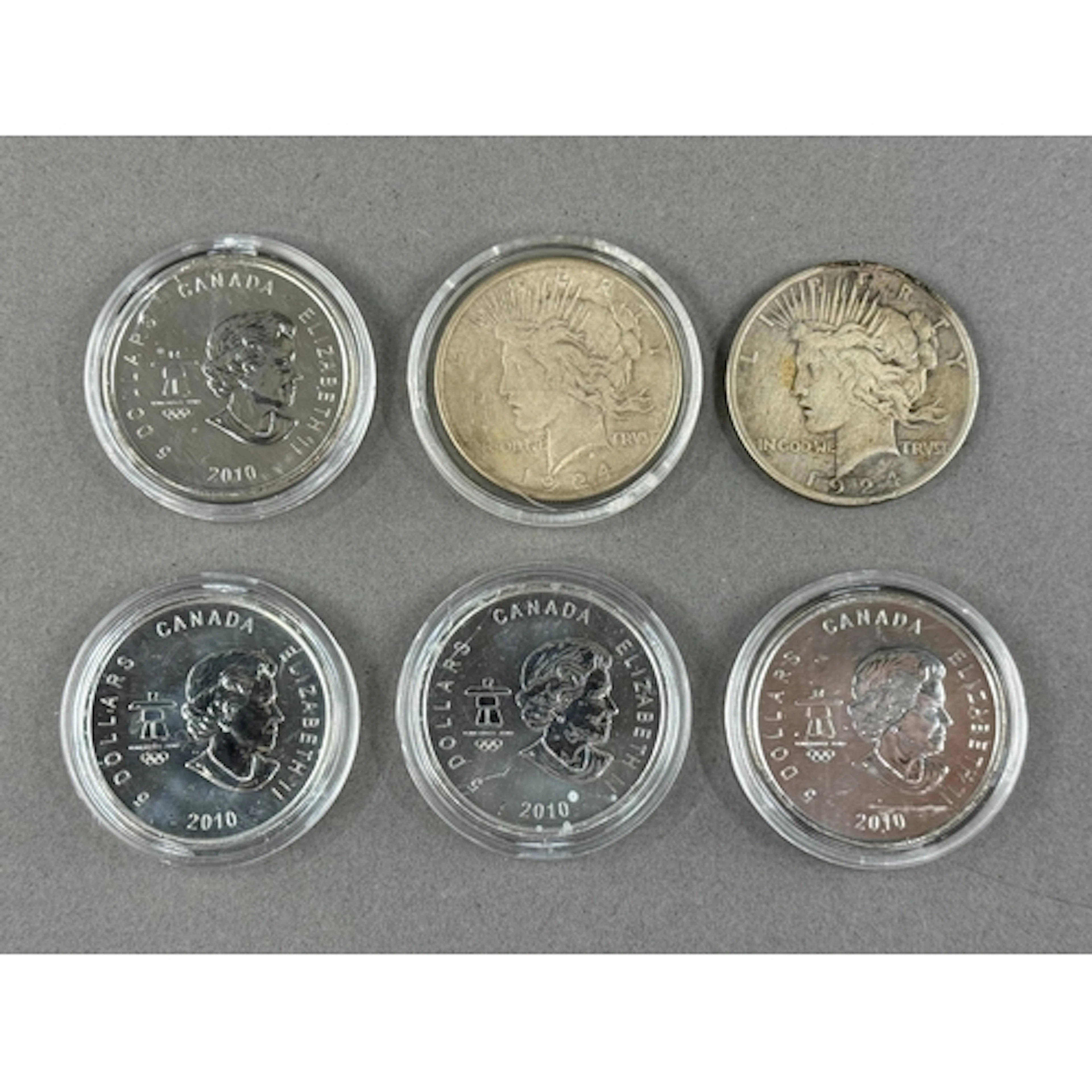 Coins: two 1924 US silver dollar coins, together with four e...