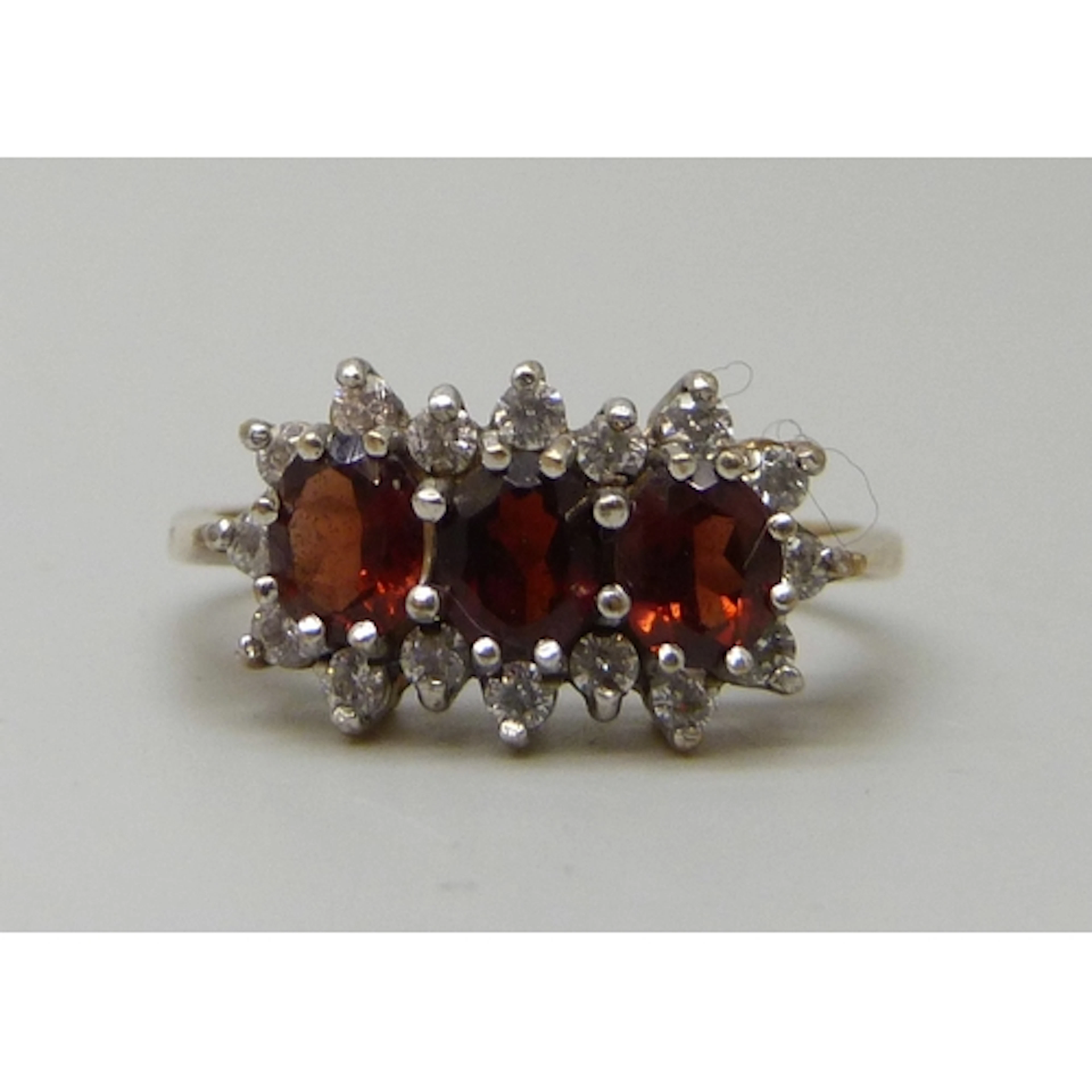 A 9ct gold, garnet and white stone cluster ring, 2.7g, Q