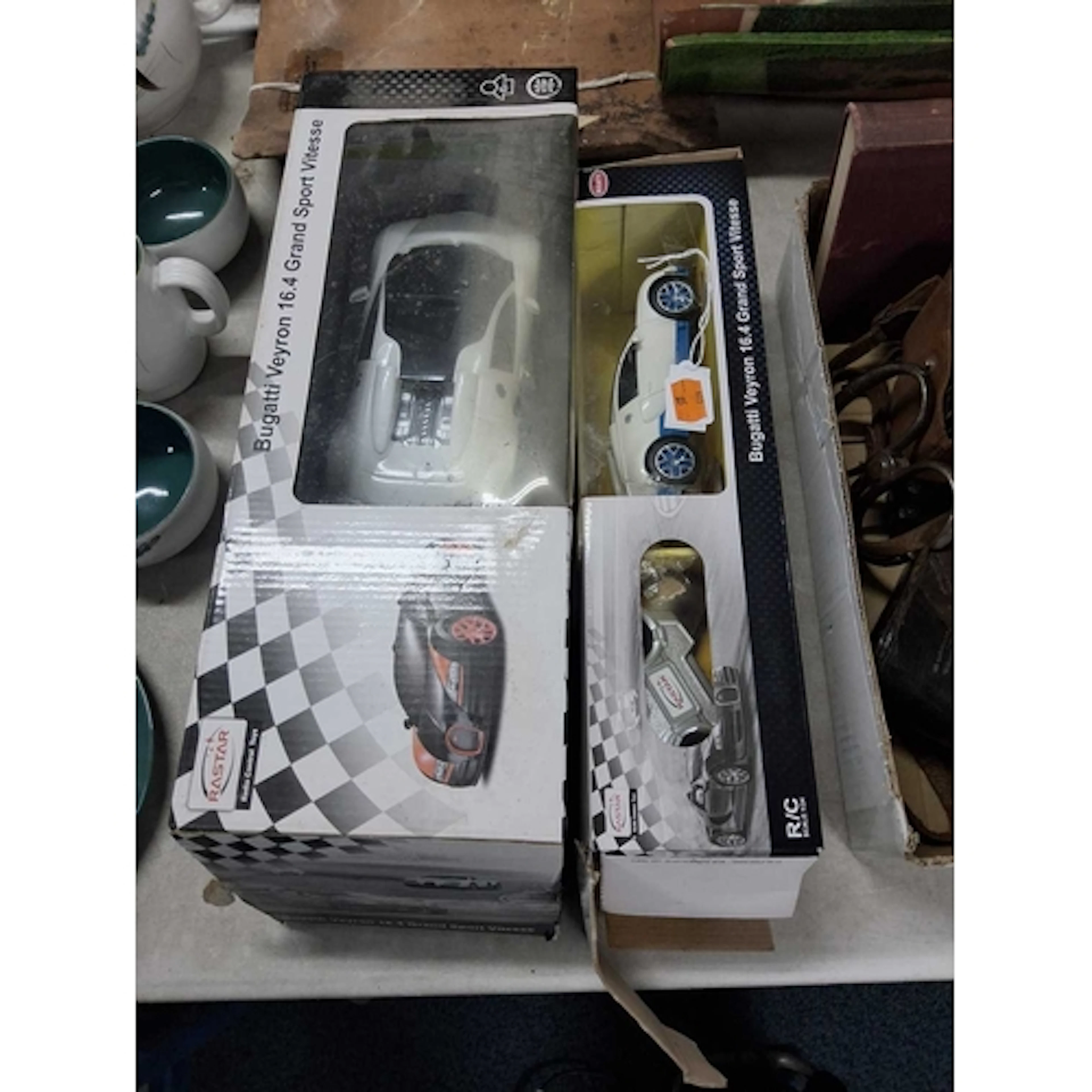 TWO BOXED RASTAR REMOTE CONTROLLED BUGATTI VEYRON CARS the f...