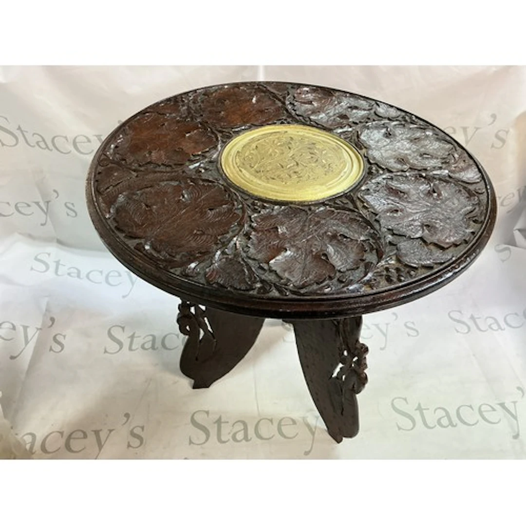 A small carved Indian table.