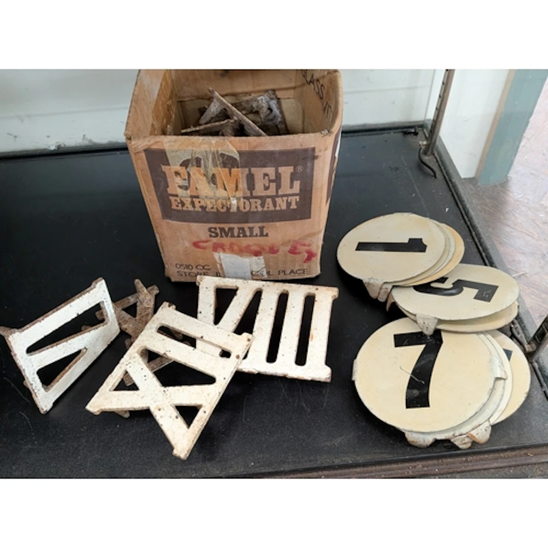 Two sets of early 20th century Clock Golf lawn markers, one ...