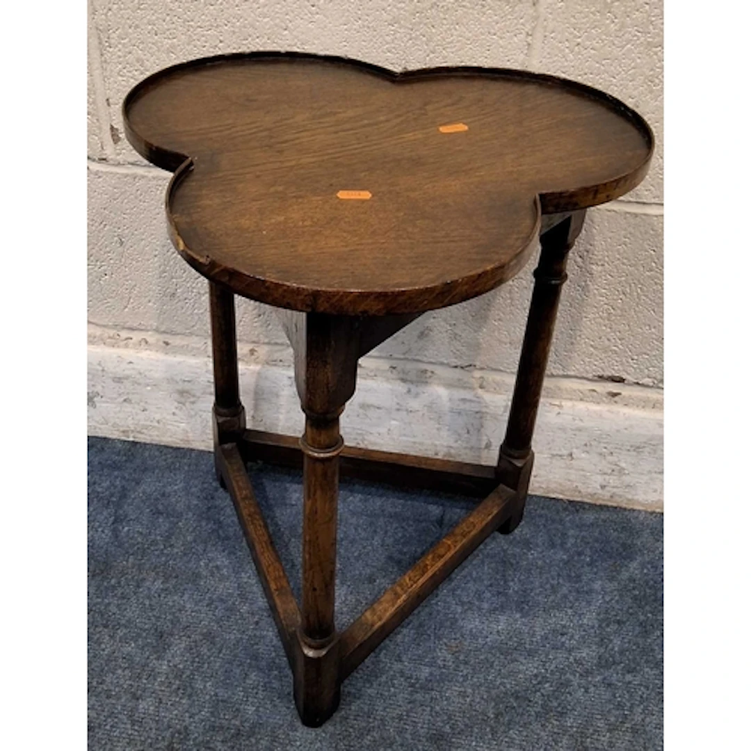 A GOOD QUALITY REPRODUCTION OAK TREFOIL / CLOVER TABLE, with...