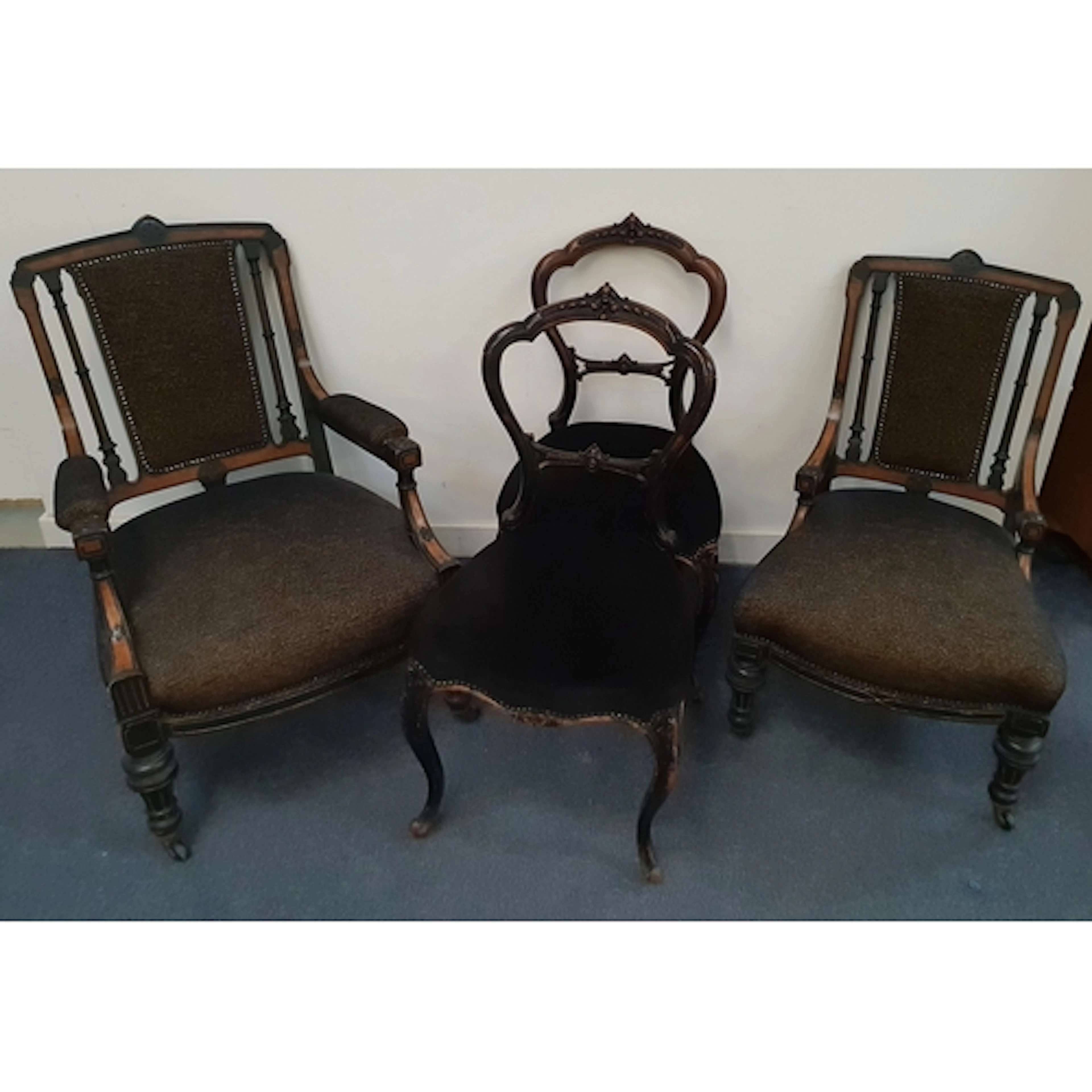 PAIR OF COMPANION LOUNGE CHAIRS featuring carved crest rail ...