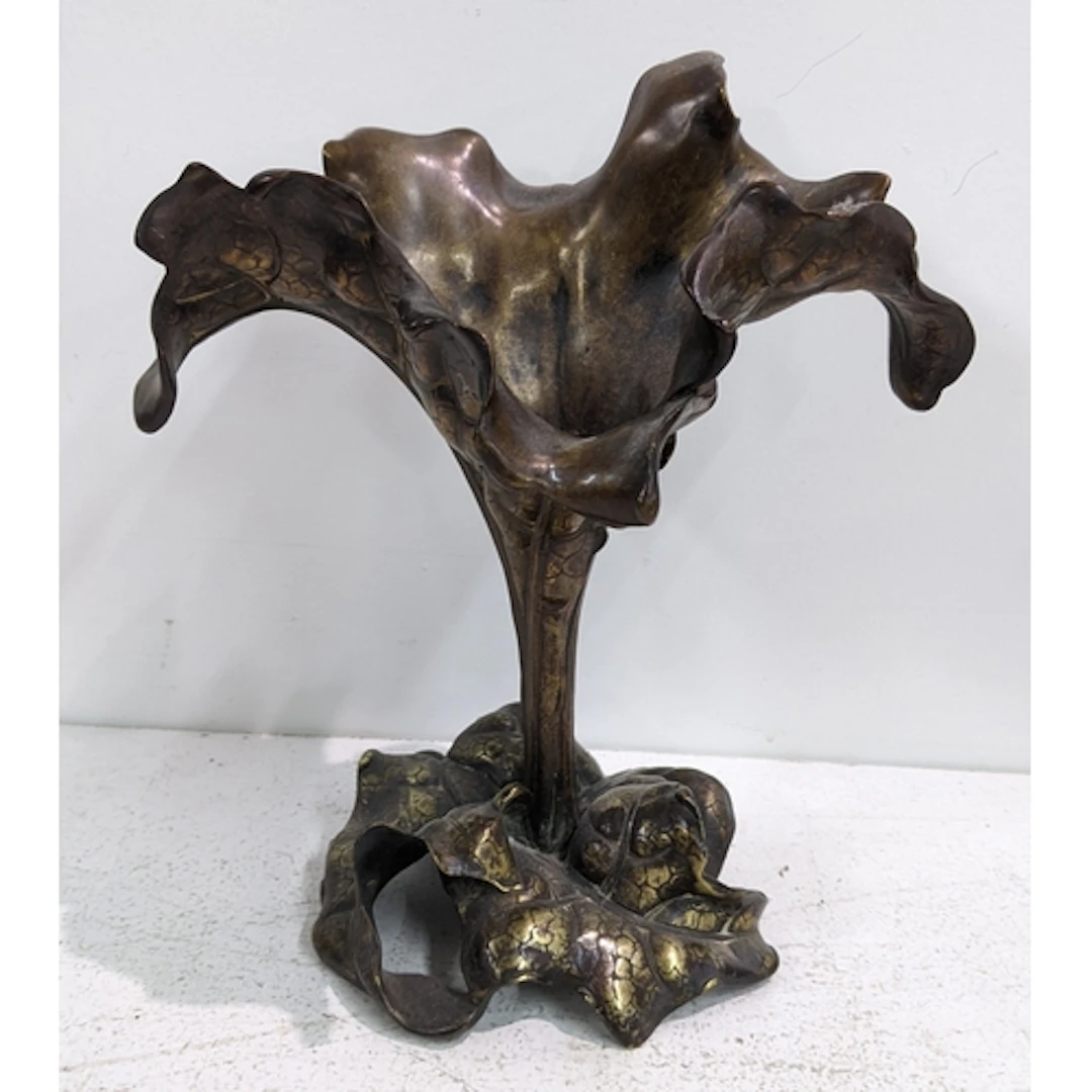 An Art Nouveau bronze lotus form centrepiece modelled with a...