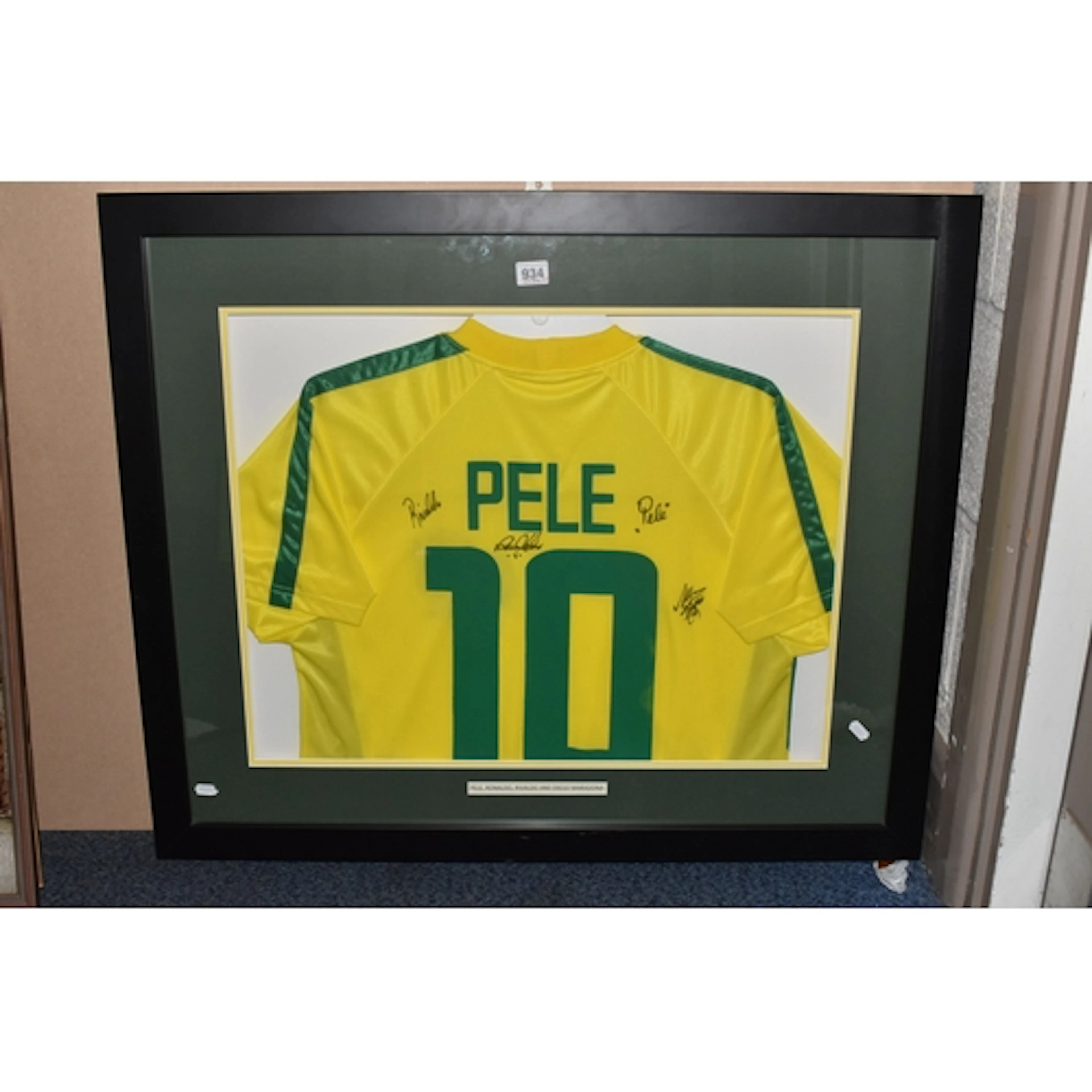 A SIGNED REPLICA PELE 10 BRAZIL FOOTBALL SHIRT with four sig...