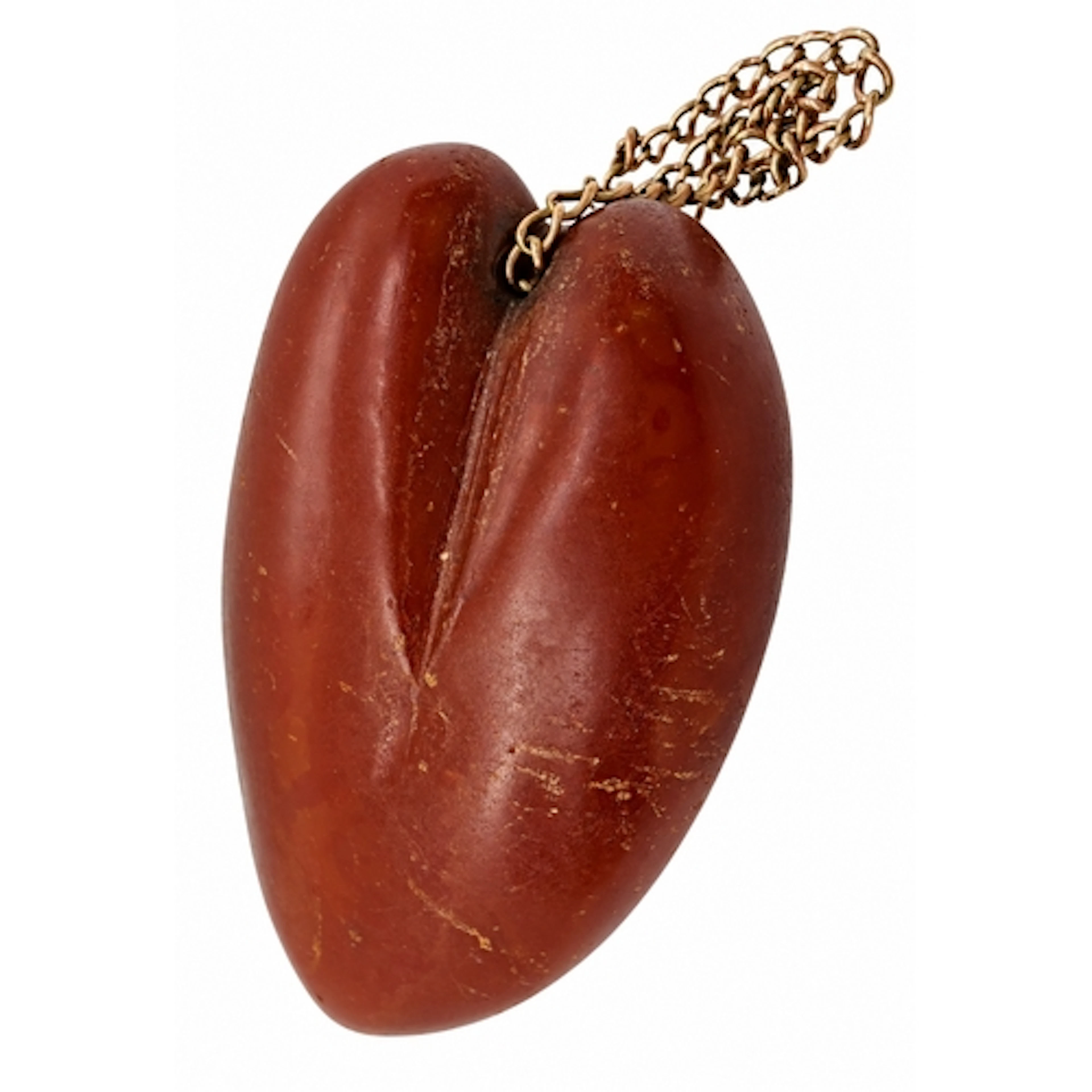 A substantial heart shaped carved amber pendant or romantic ...