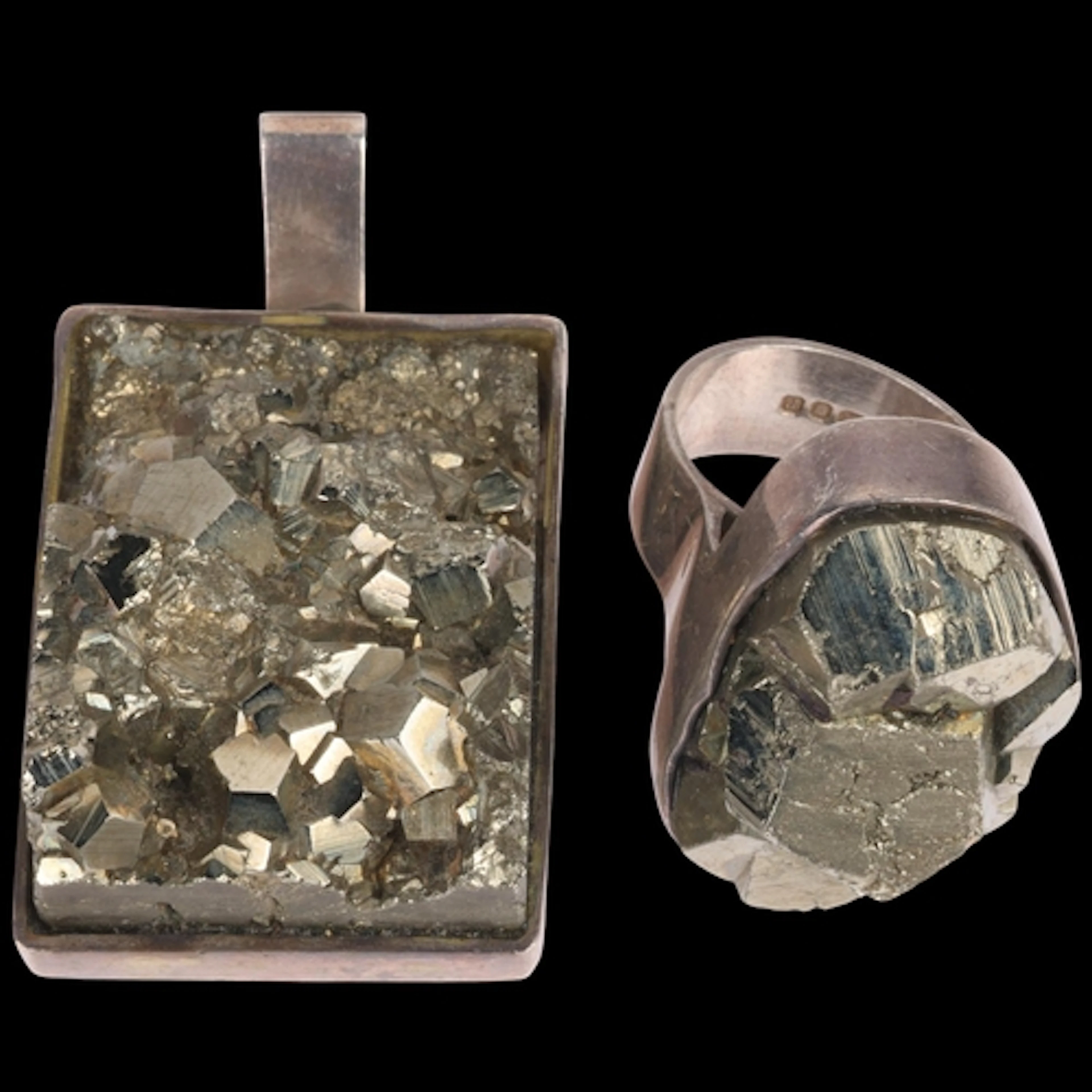 A heavy British modernist sterling silver pyrite pendant and...