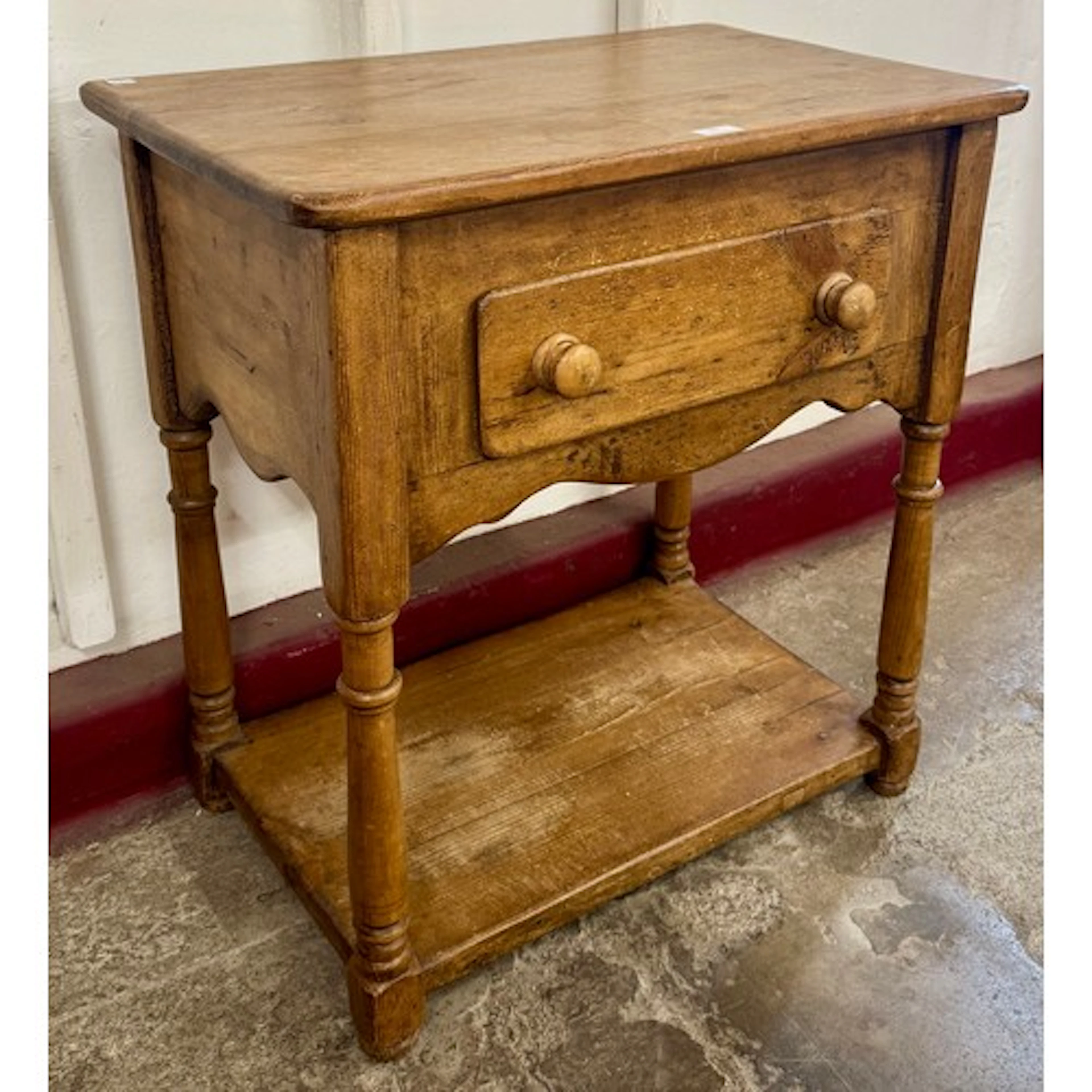 A Victorian style pine single drawer side table