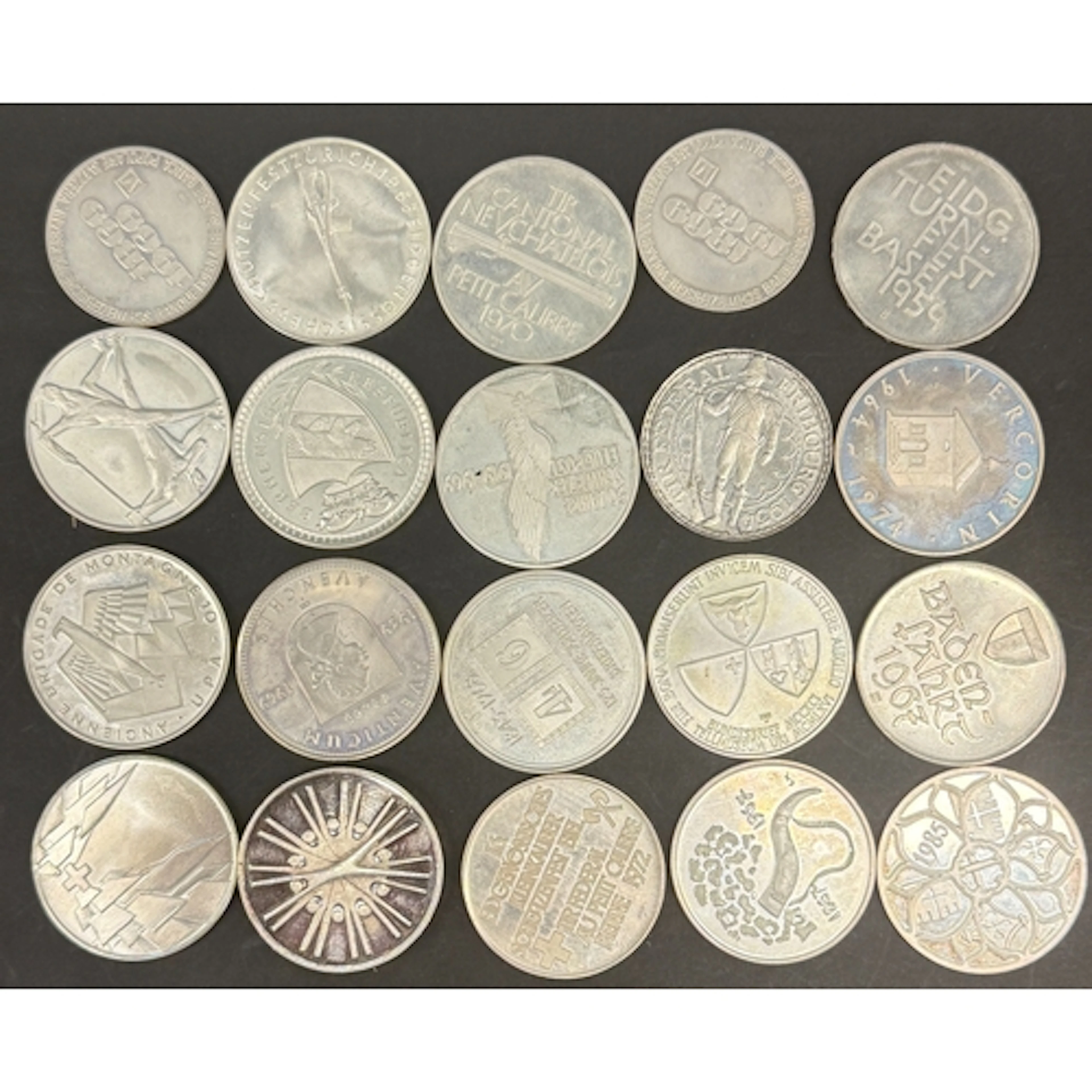 A collection of 20 Swiss .900 silver commemorative medals, m...