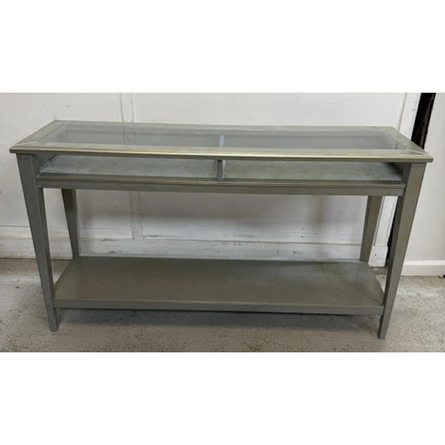 A contemporary bronze silver glass topped console table....
