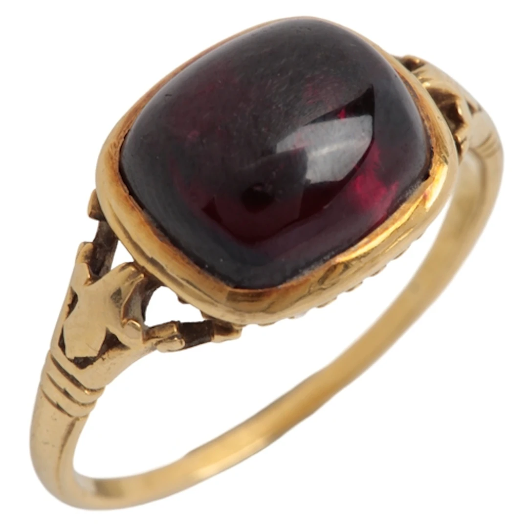 A garnet ring, early 19th century, set with a cushion-shaped...