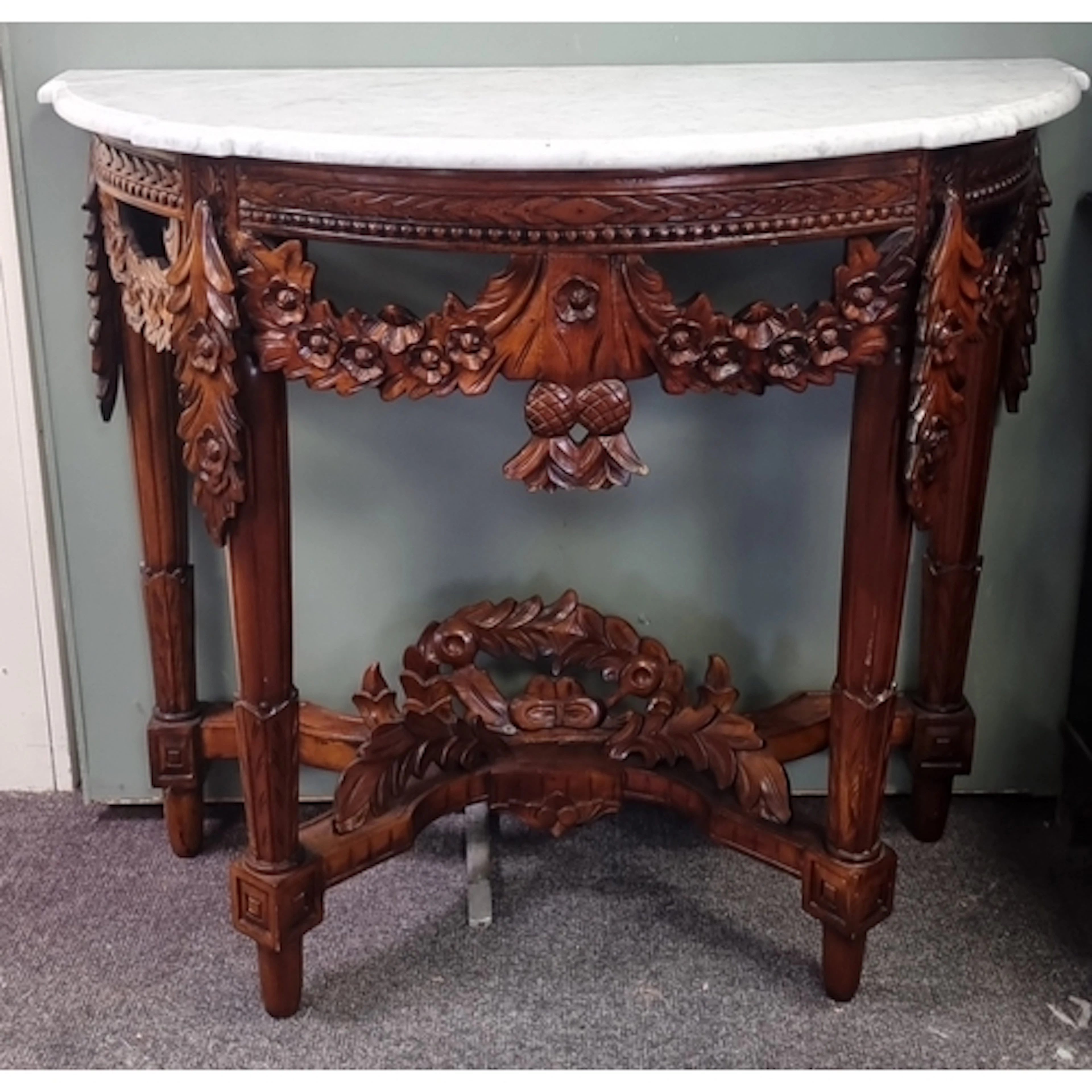 Ornately carved mahogany demi-lune console table with white ...