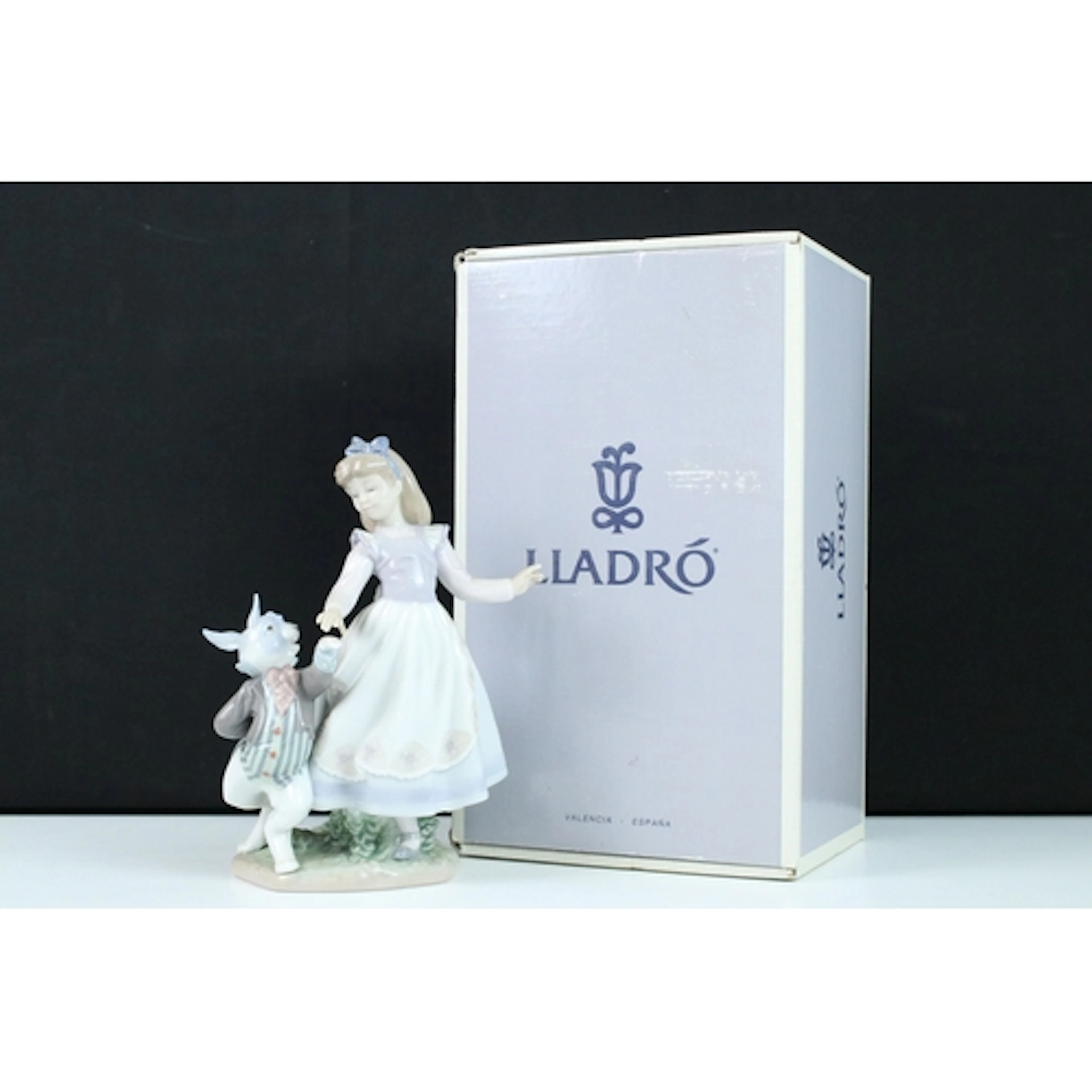 Lladro figure of Alice in Wonderland, model no. 5740, depict...
