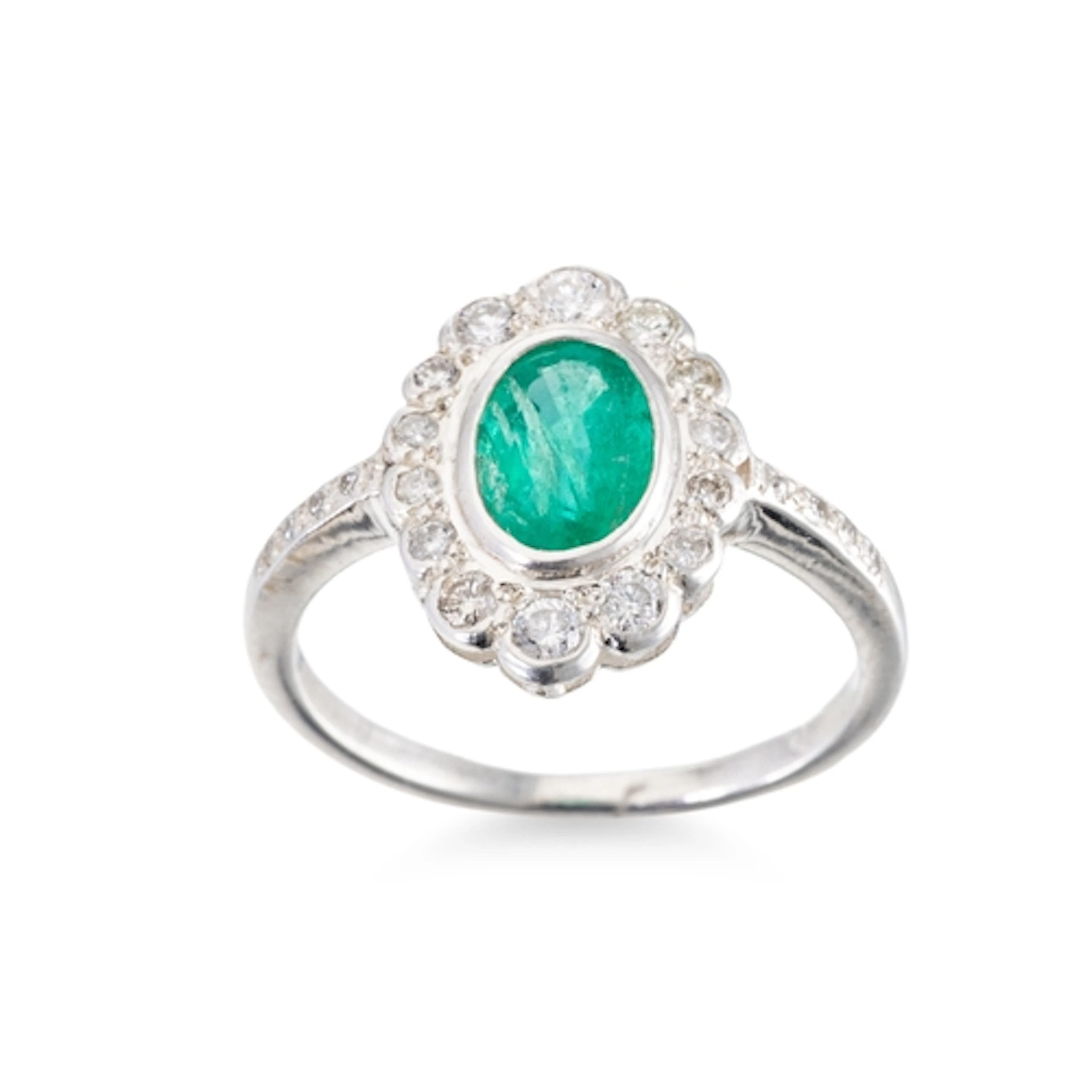 A DIAMOND AND EMERALD RING, mounted in silver, size L-M