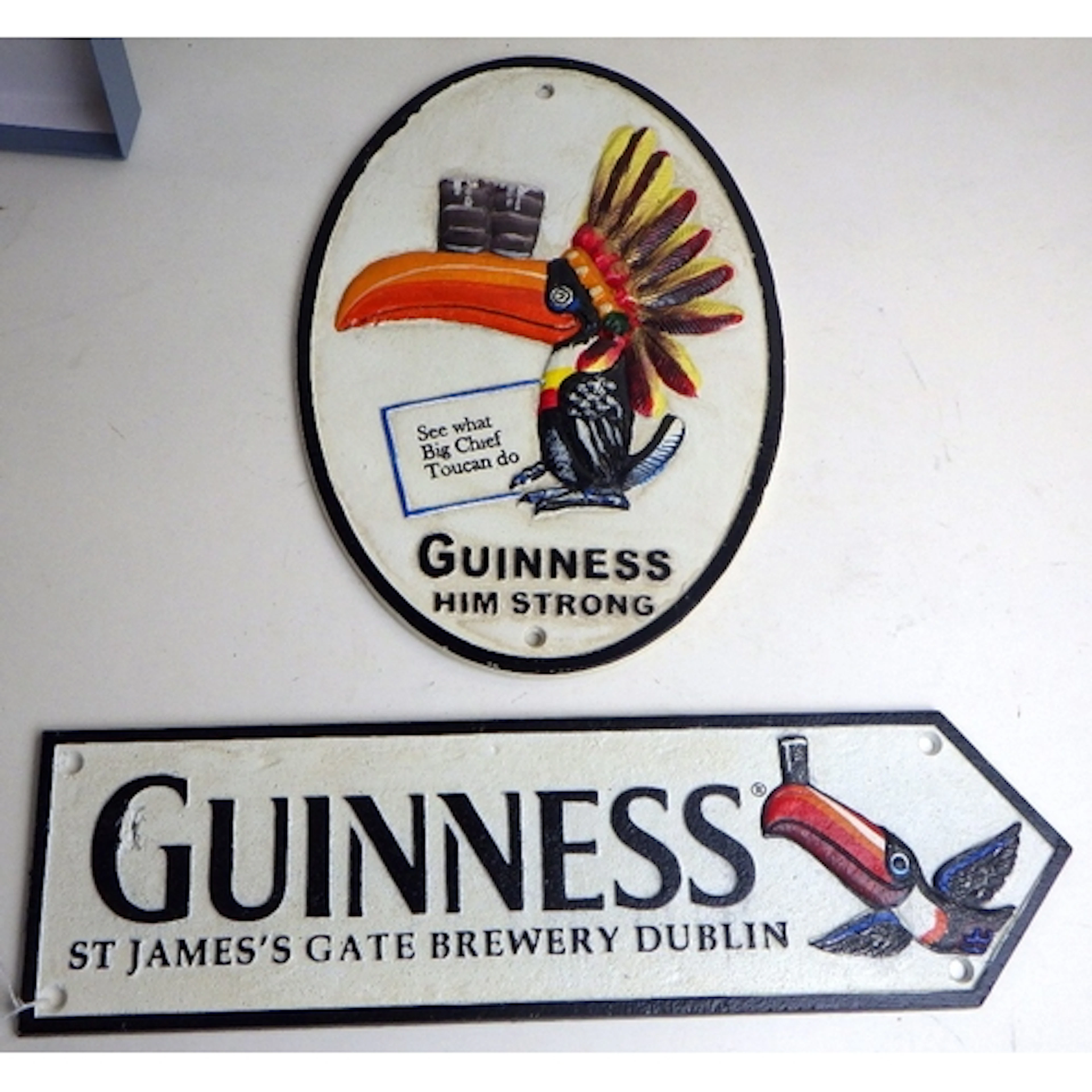 Two modern cast iron Guinness advertising signs (2)