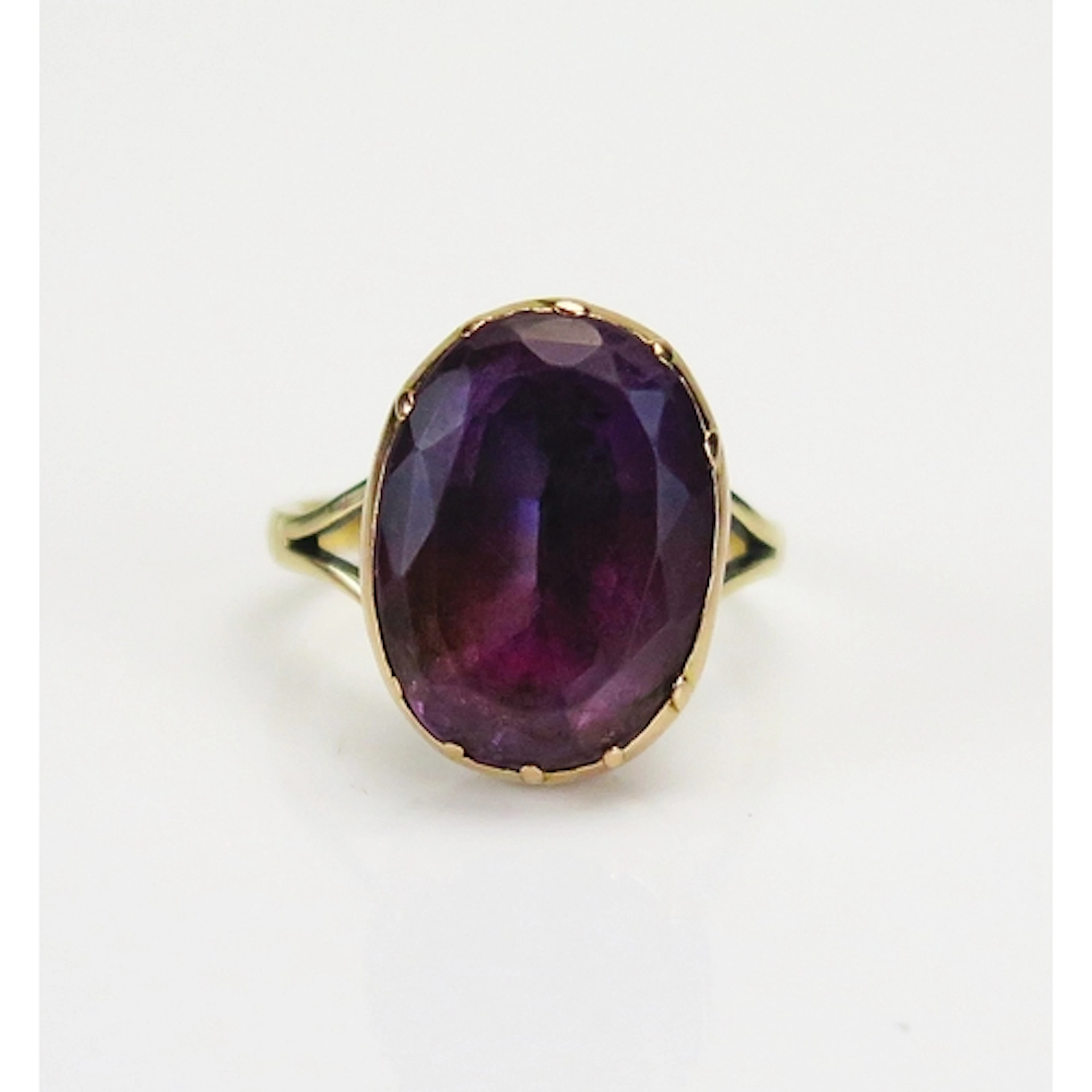 A Georgian foil backed amethyst ring in a precious yellow me...