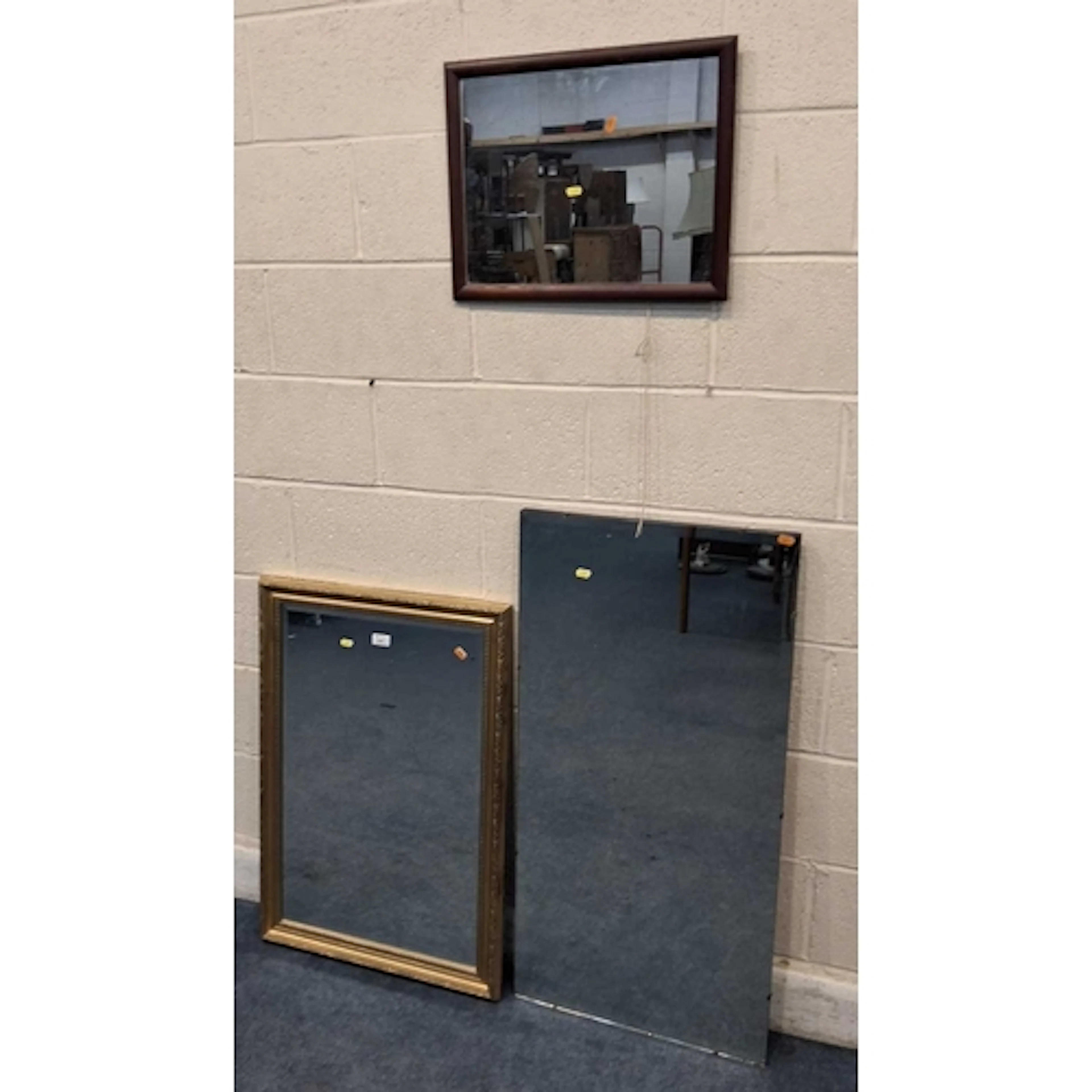 A GILT WOOD RECTANGULAR BEVELLED EDGE WALL MIRROR, along wit...