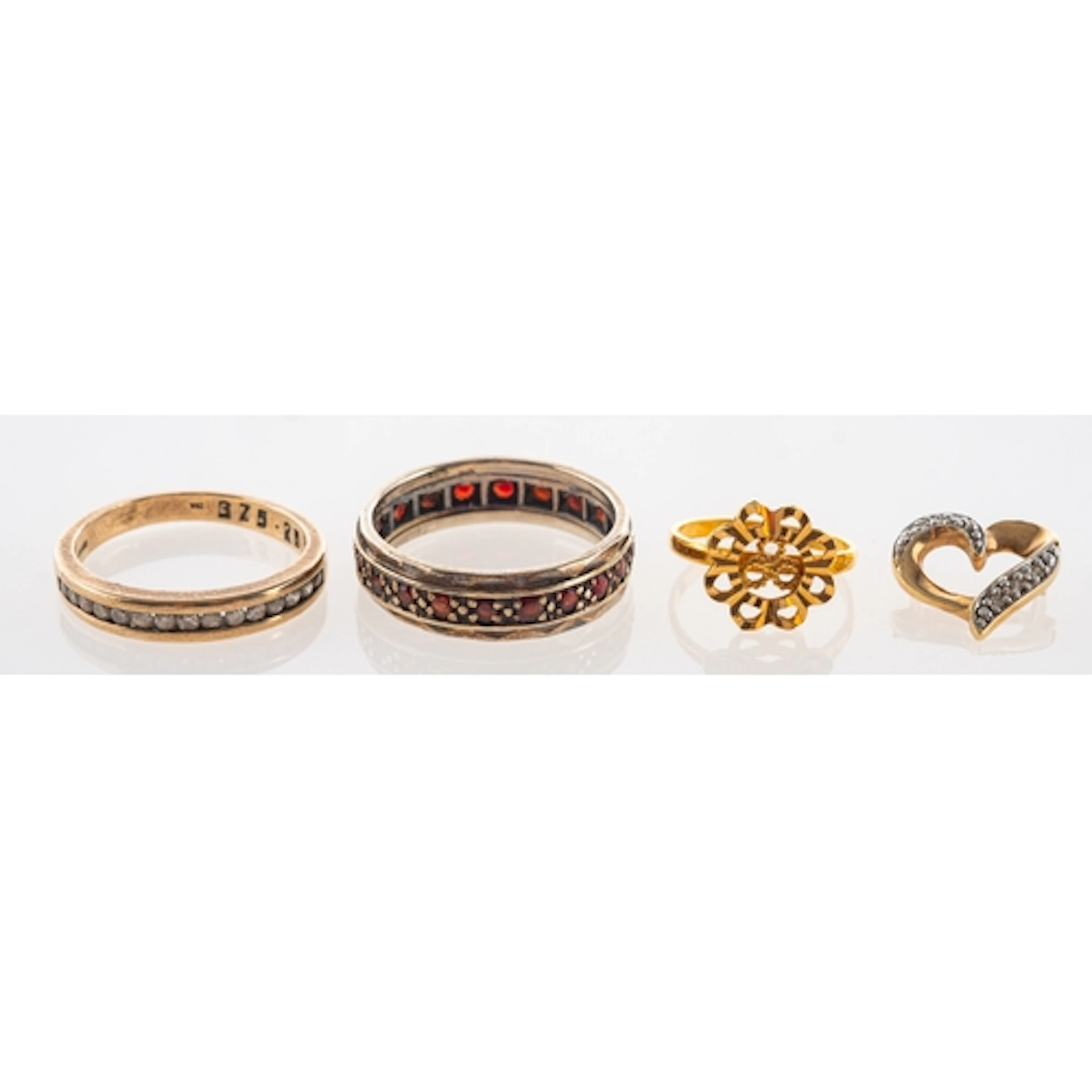 A high grade yellow metal baby ring (testing at 22ct) gross ...