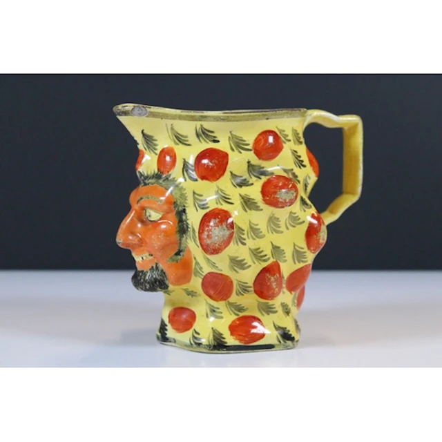 19th century Staffordshire pottery Satyr mask jug, on canary...