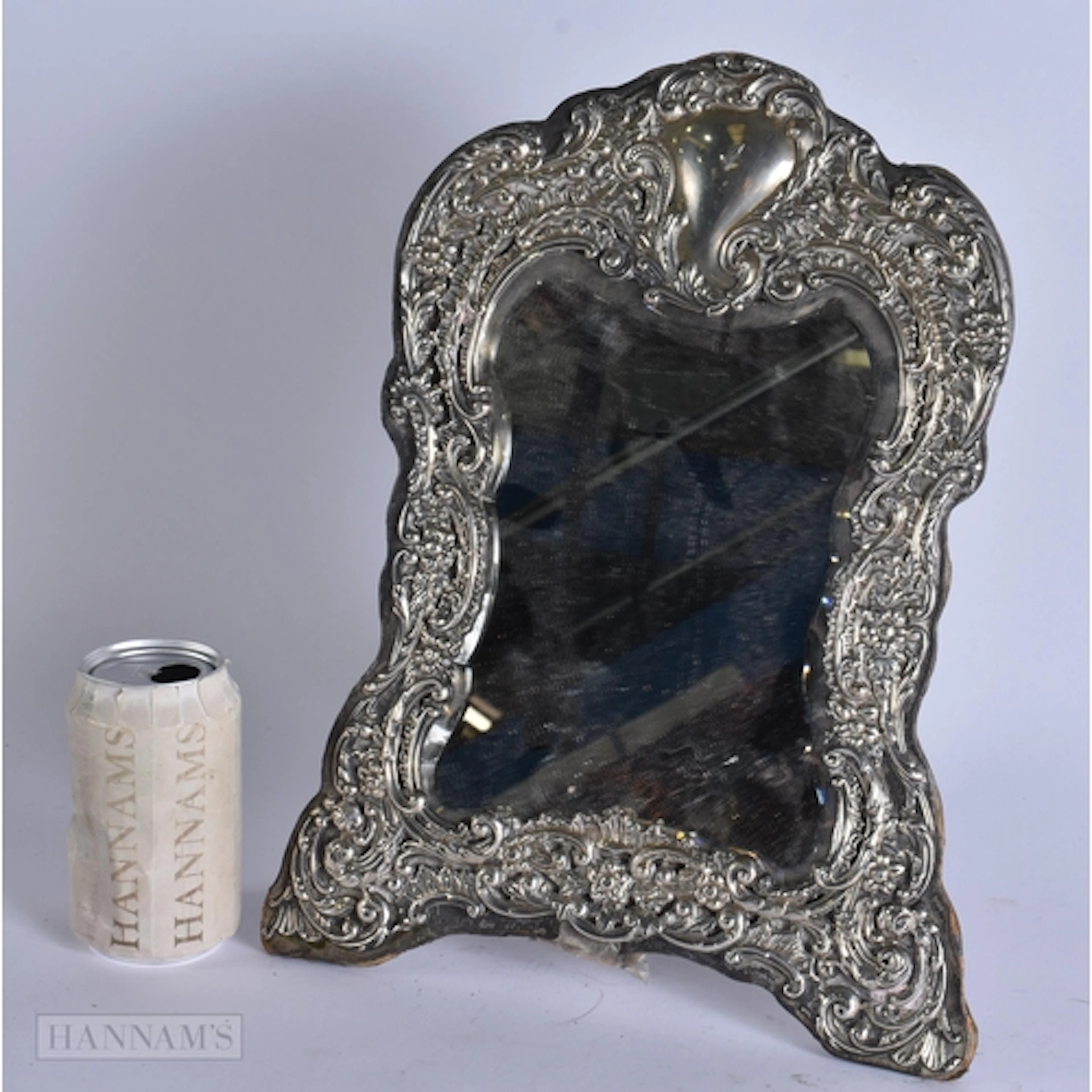 AN ANTIQUE SILVER MIRROR. 36 cm x 26 cm.