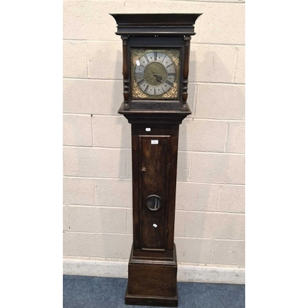 AN OAK CASED 30 HOUR LONGCASE CLOCK, the glass door enclosin...