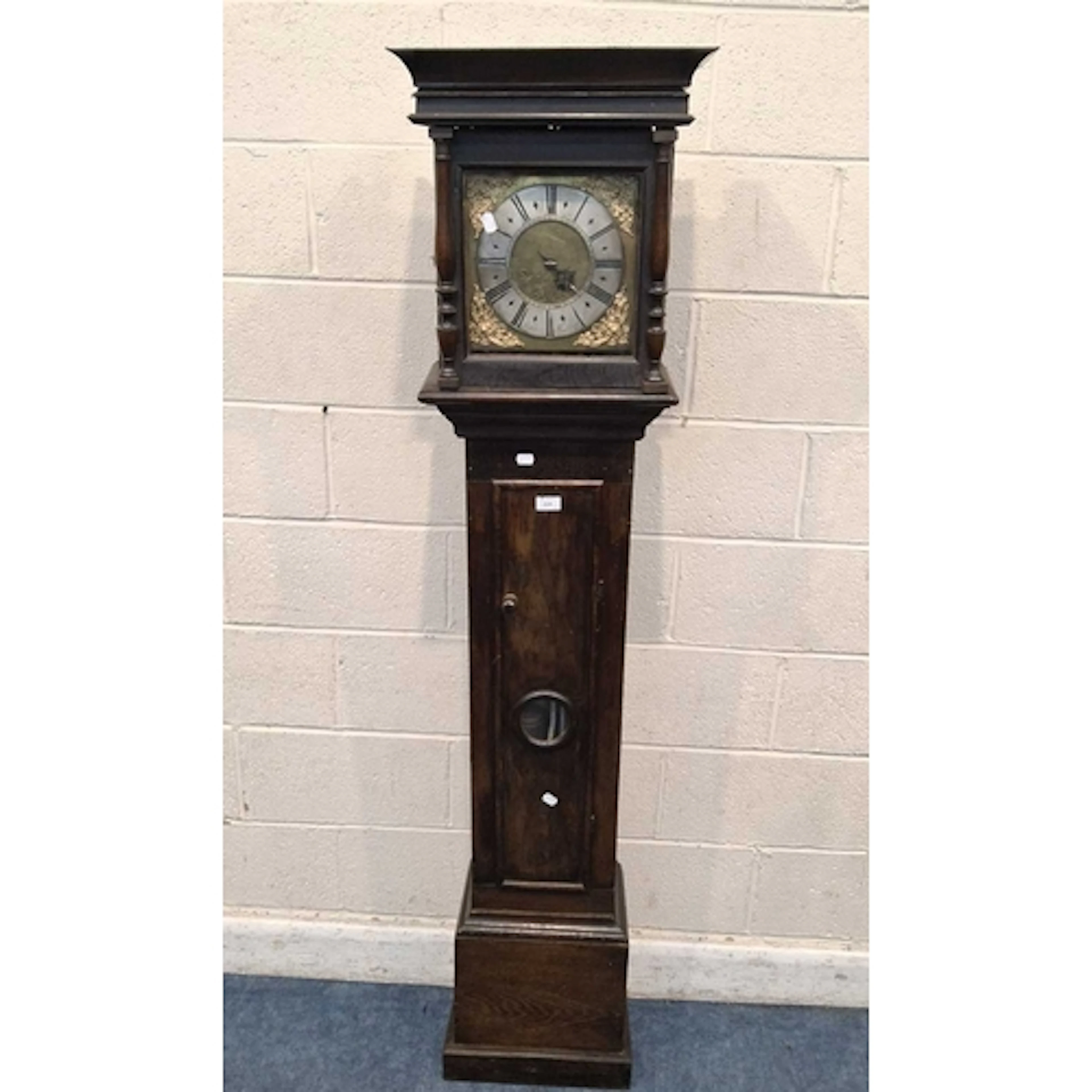 AN OAK CASED 30 HOUR LONGCASE CLOCK, the glass door enclosin...