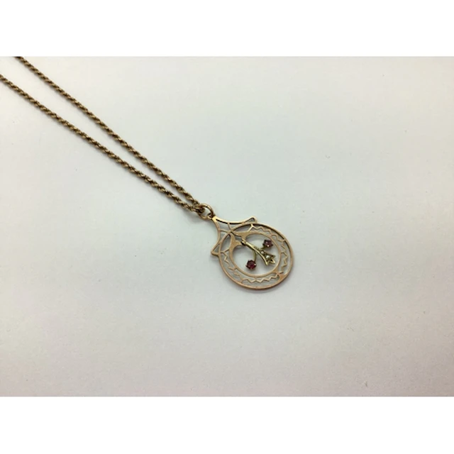 An Edwardian Rose Coloured Openwork Pendant, the articulated...