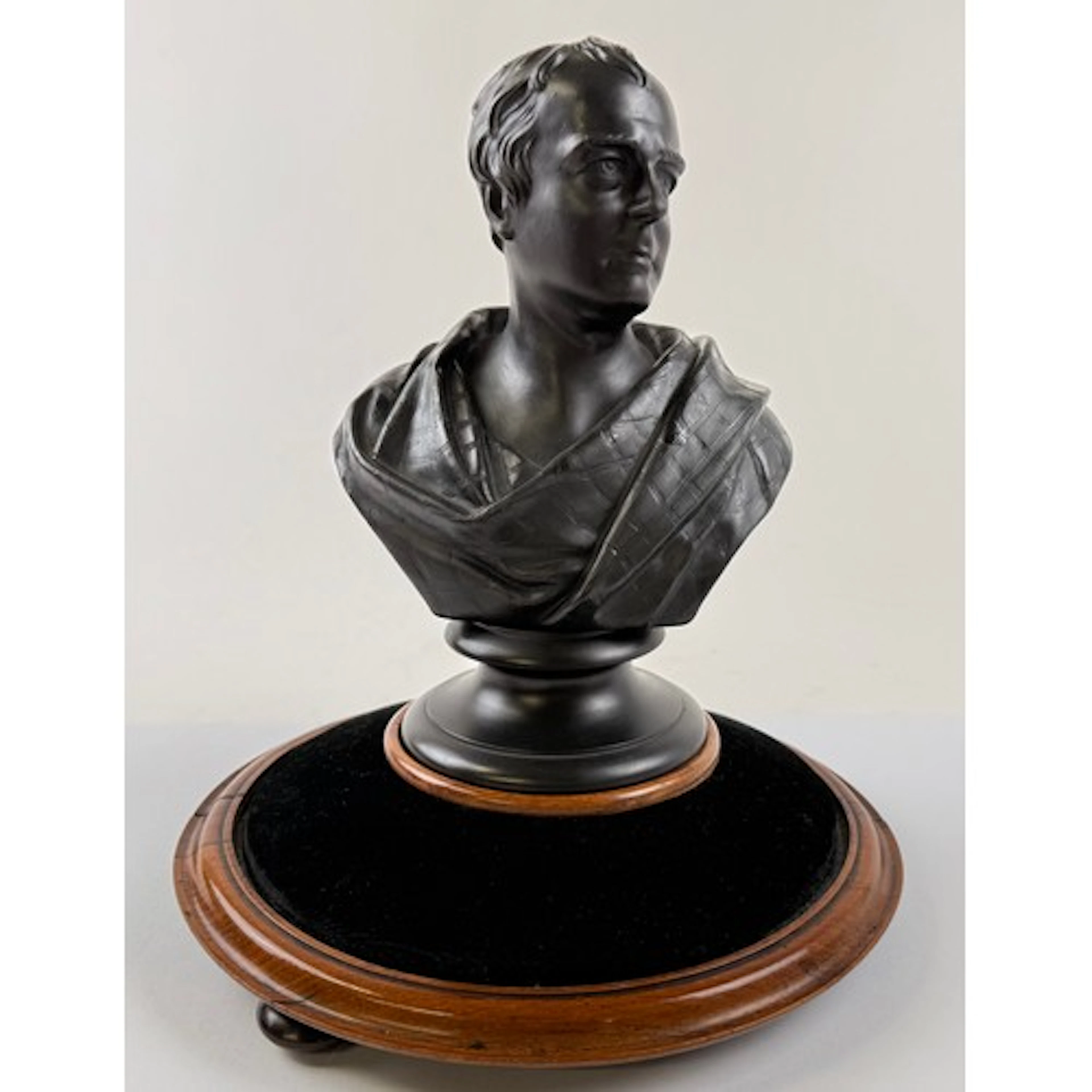 A 19th century Wedgwood black basalt bust on stand, Sir Walt...