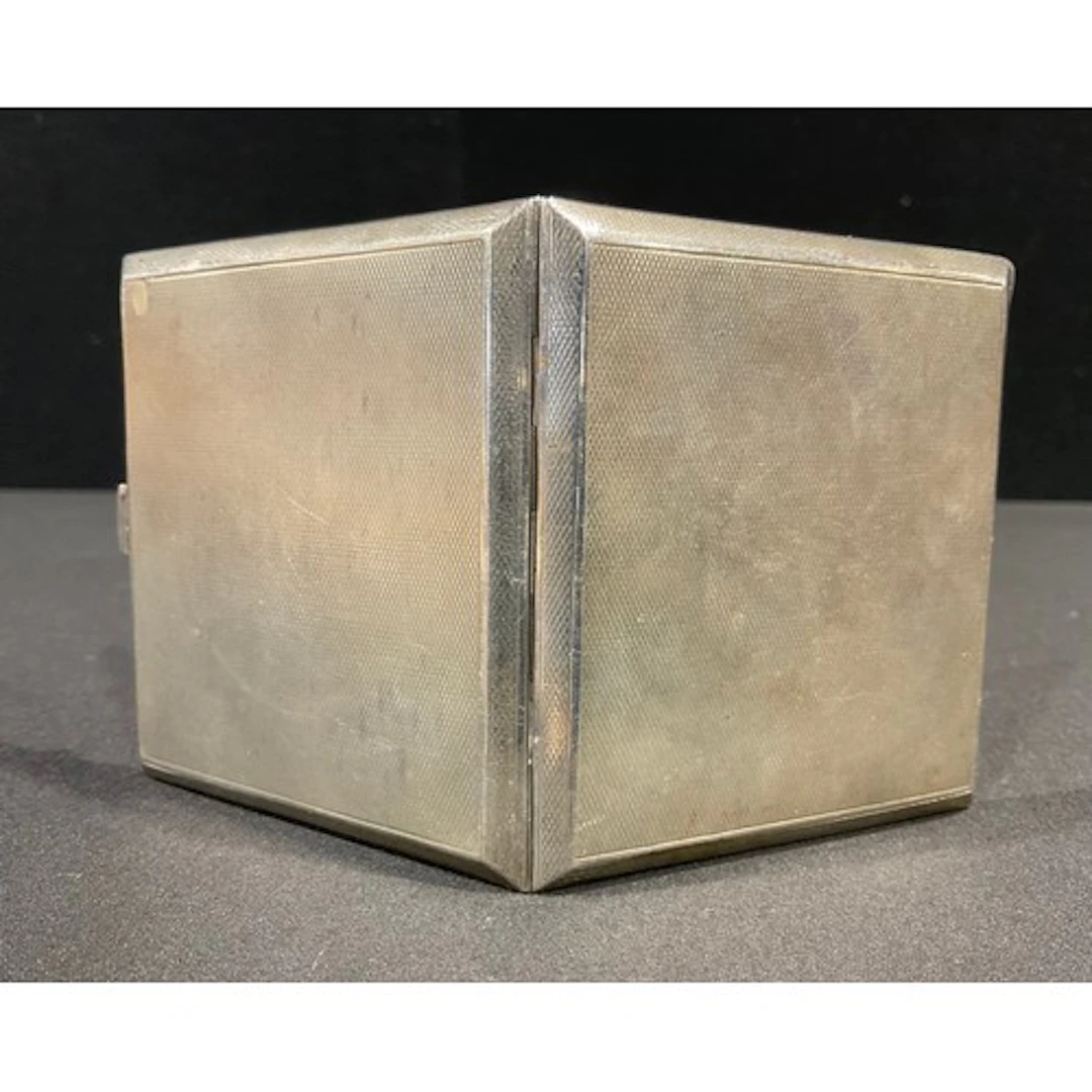 A George VI silver cigarette case, machine turned, gilt inte...