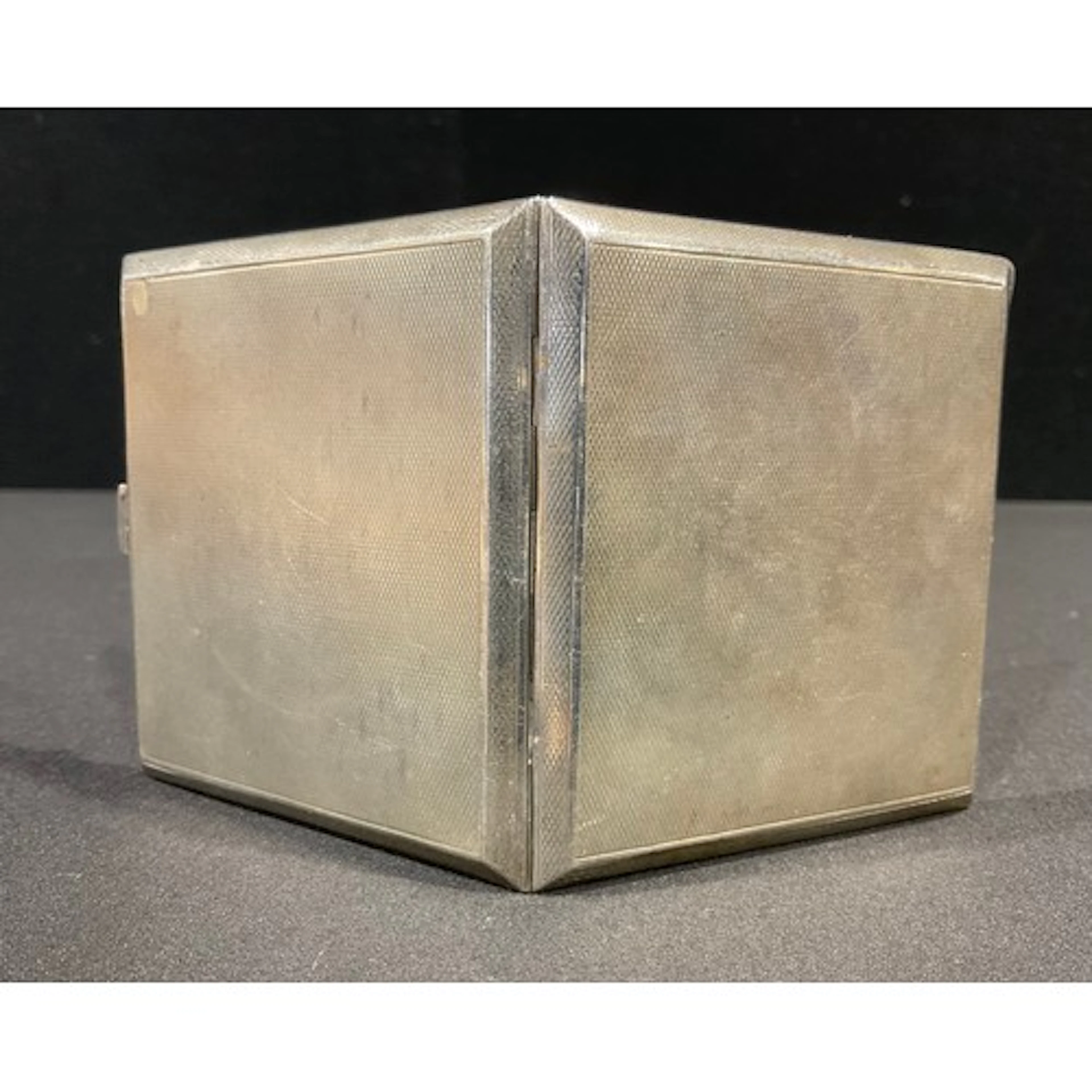 A George VI silver cigarette case, machine turned, gilt inte...