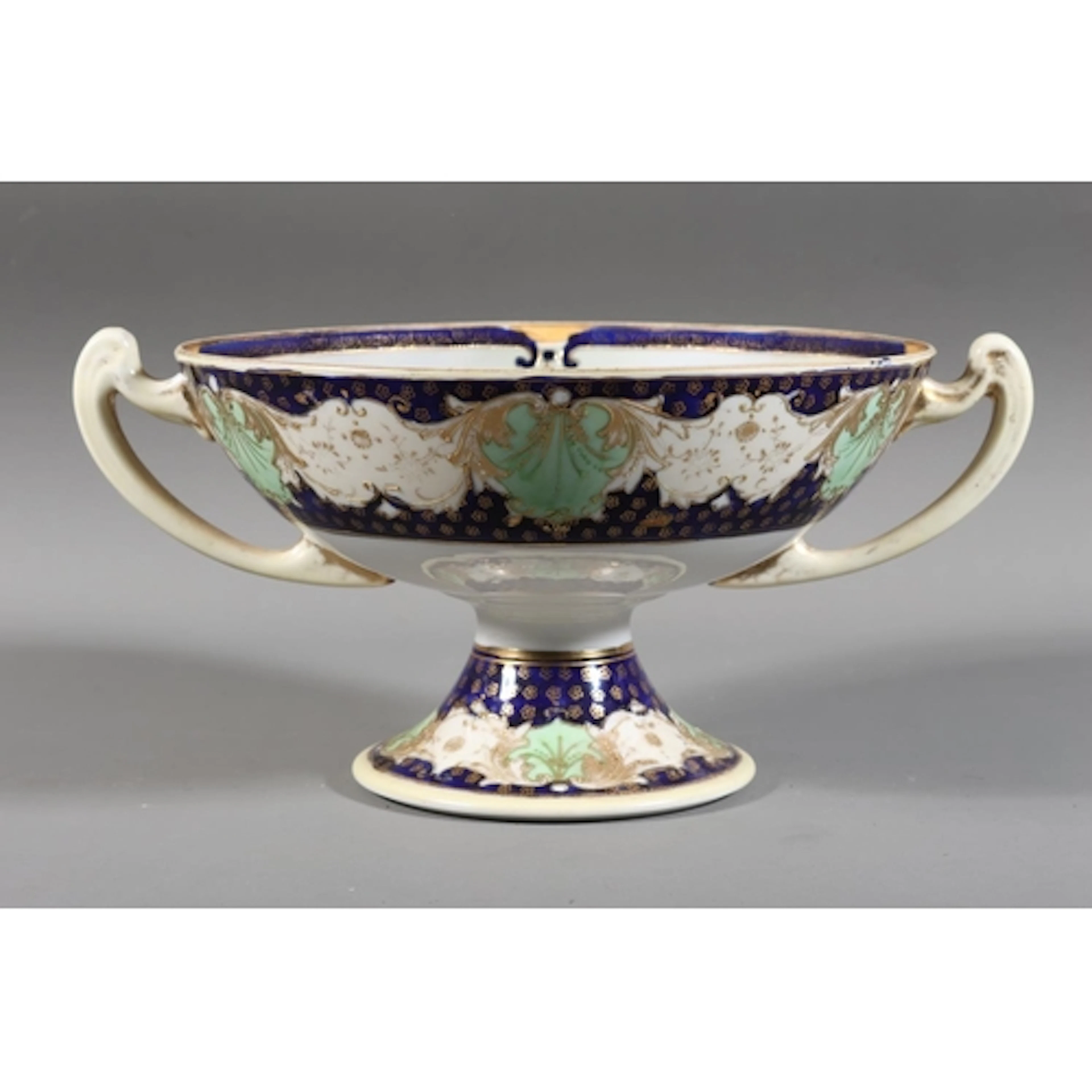 Noritake twin-handled tazza decorated with countryside river...
