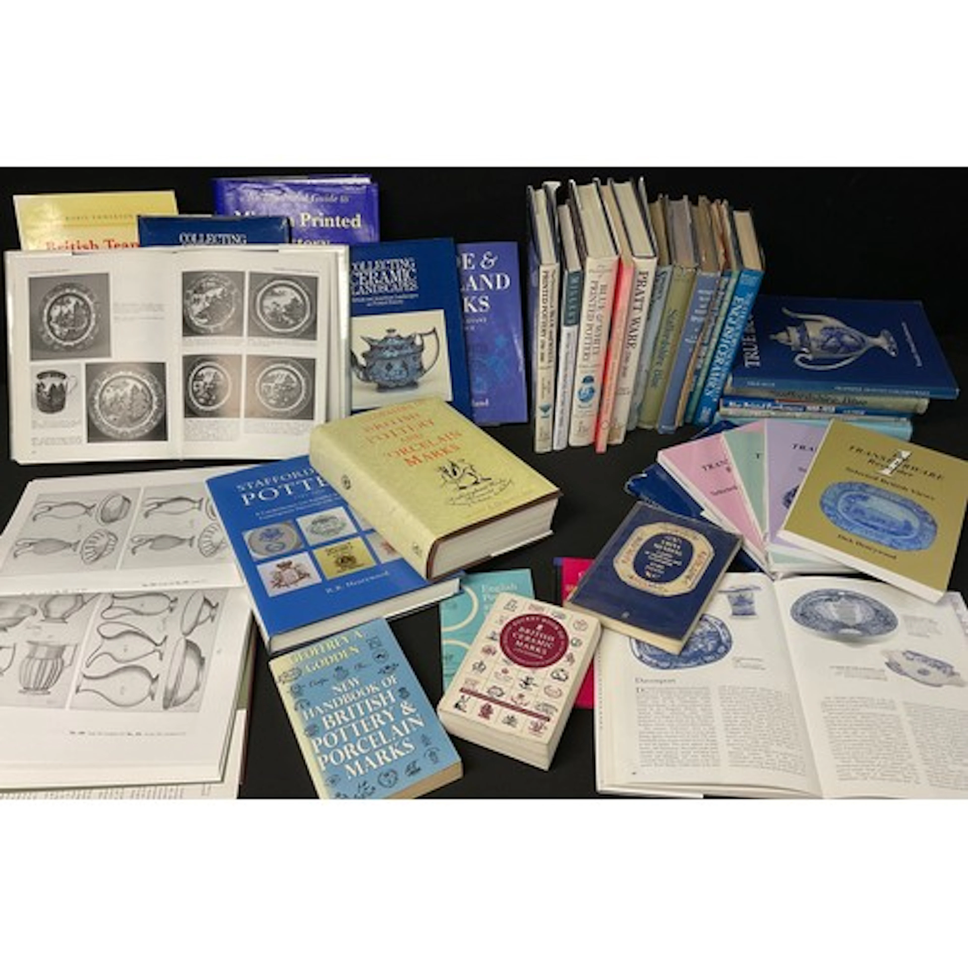 Books - mostly blue and white reference books including, The...