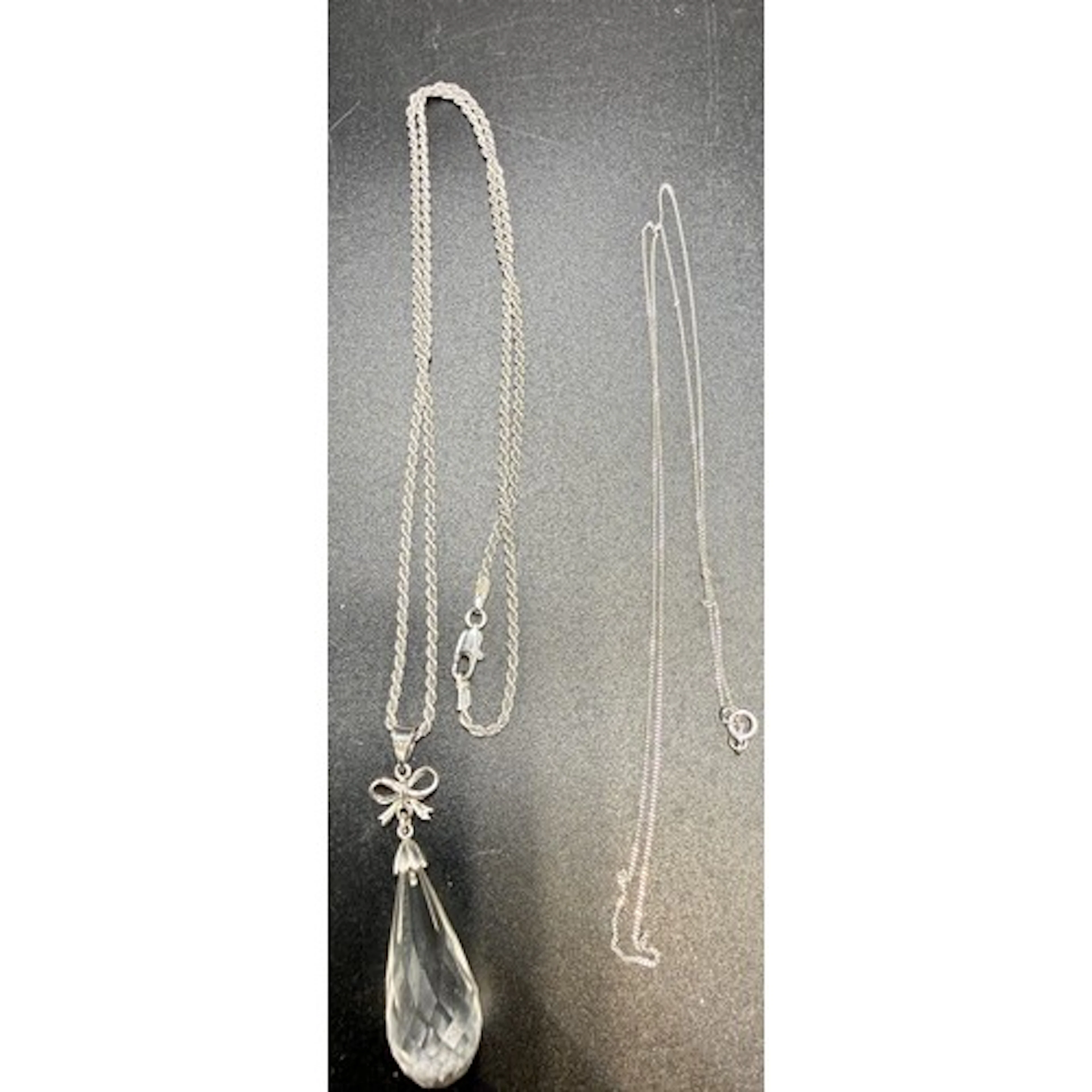 A 9 carat white gold and crystal pendant and chain, 45cm l t...
