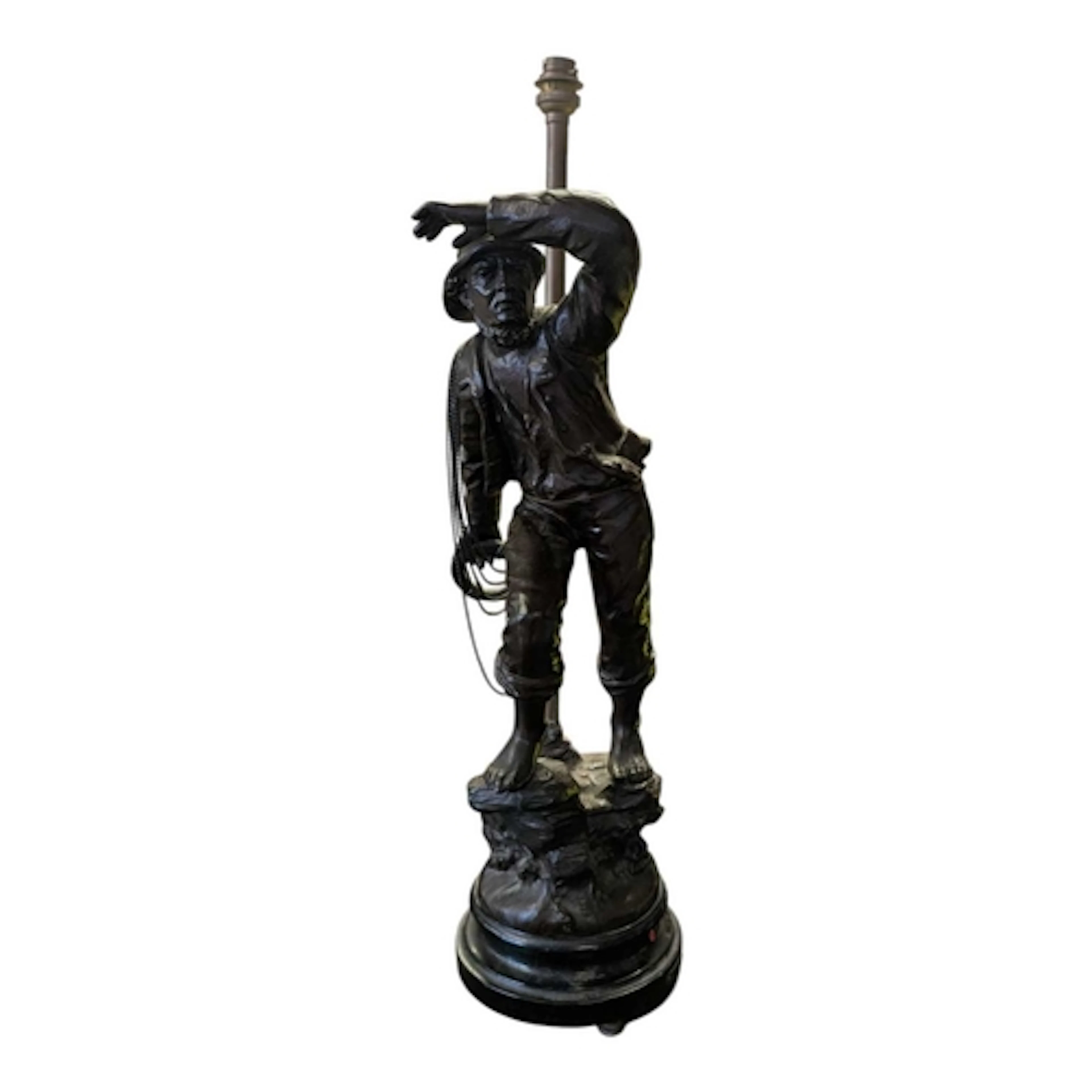 A 20th century bronzed spelter fisherman statue lamp. In the...