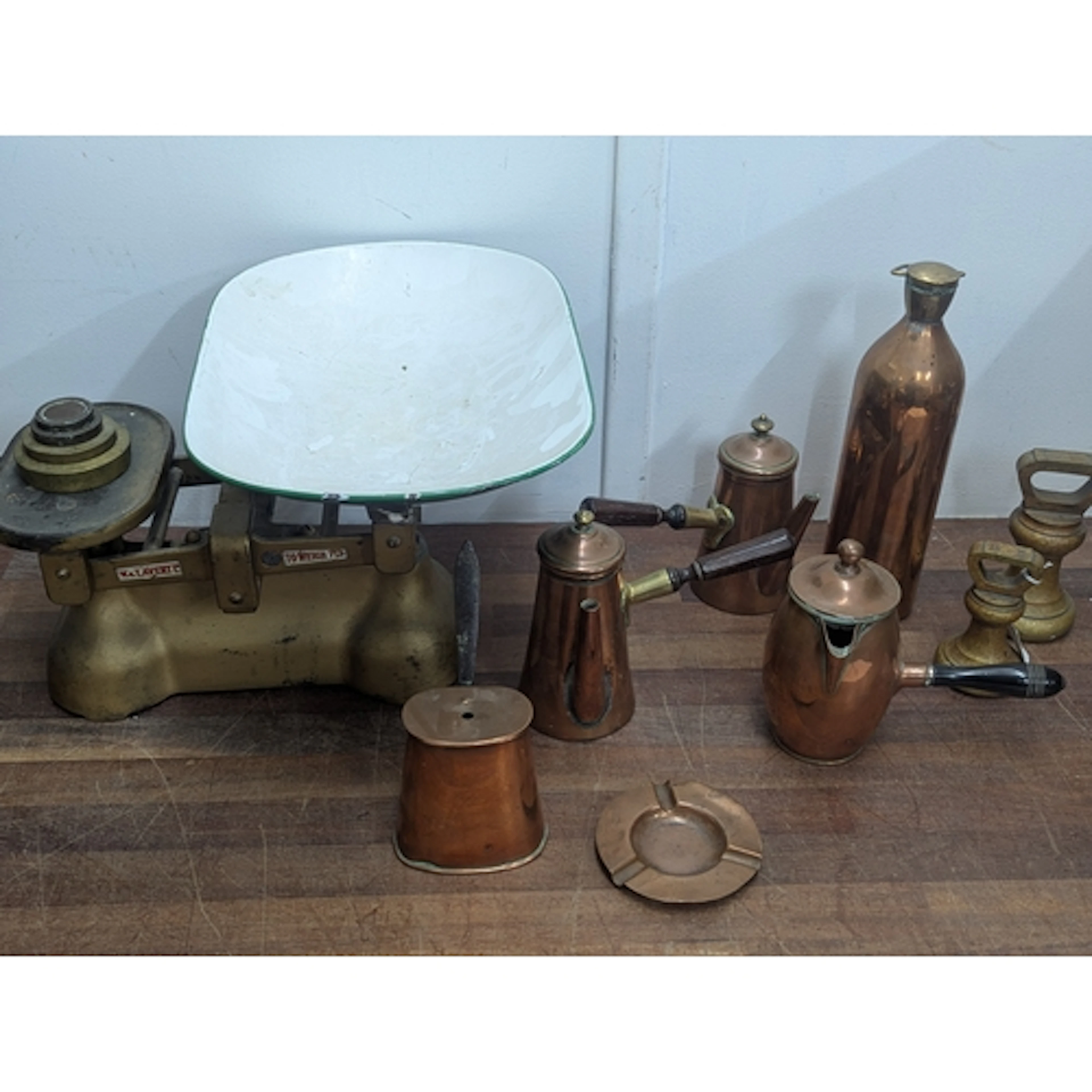 A set of kitchen scales, together with two dumbbell weights ...