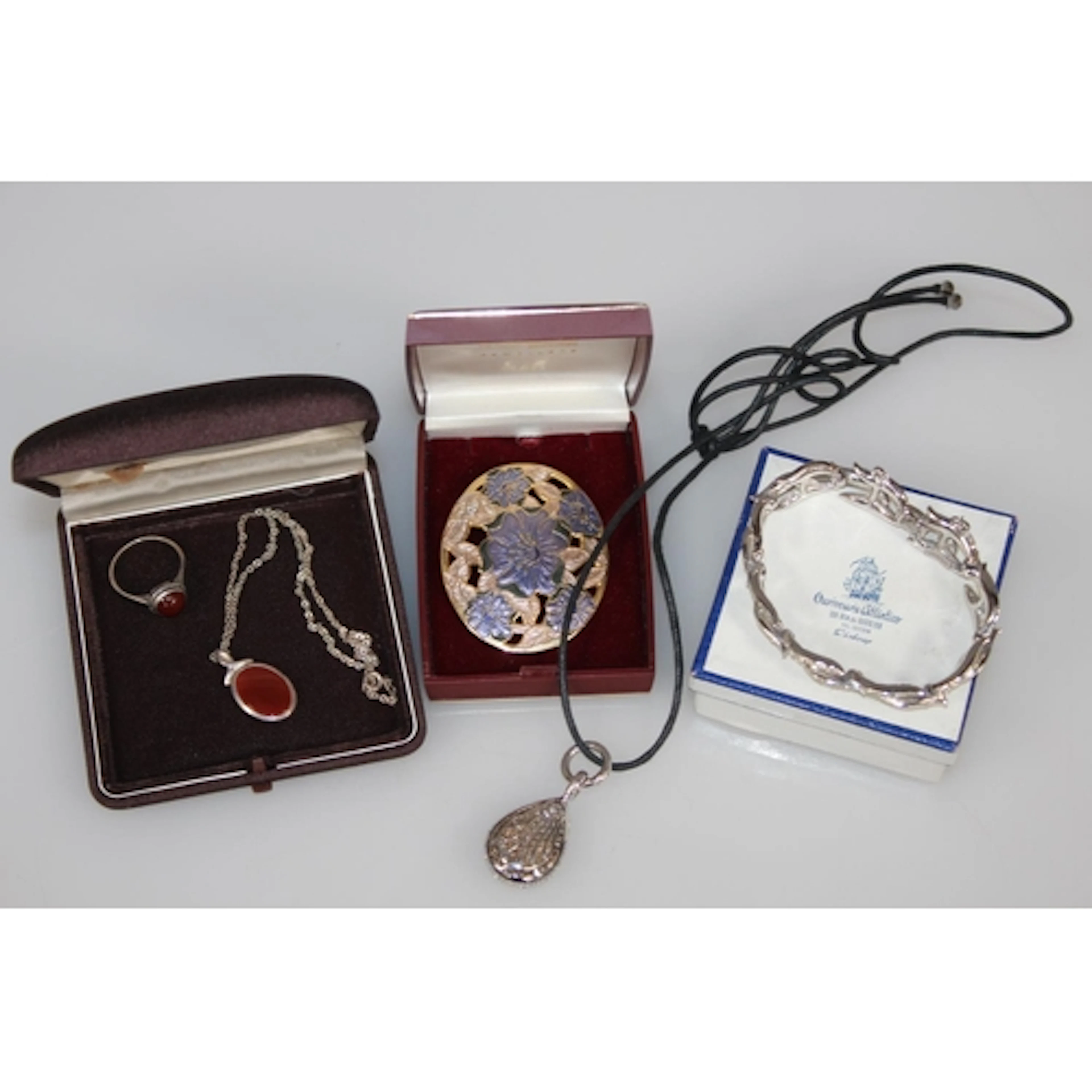 Silver cabochon carnelian set dress ring and a similar penda...