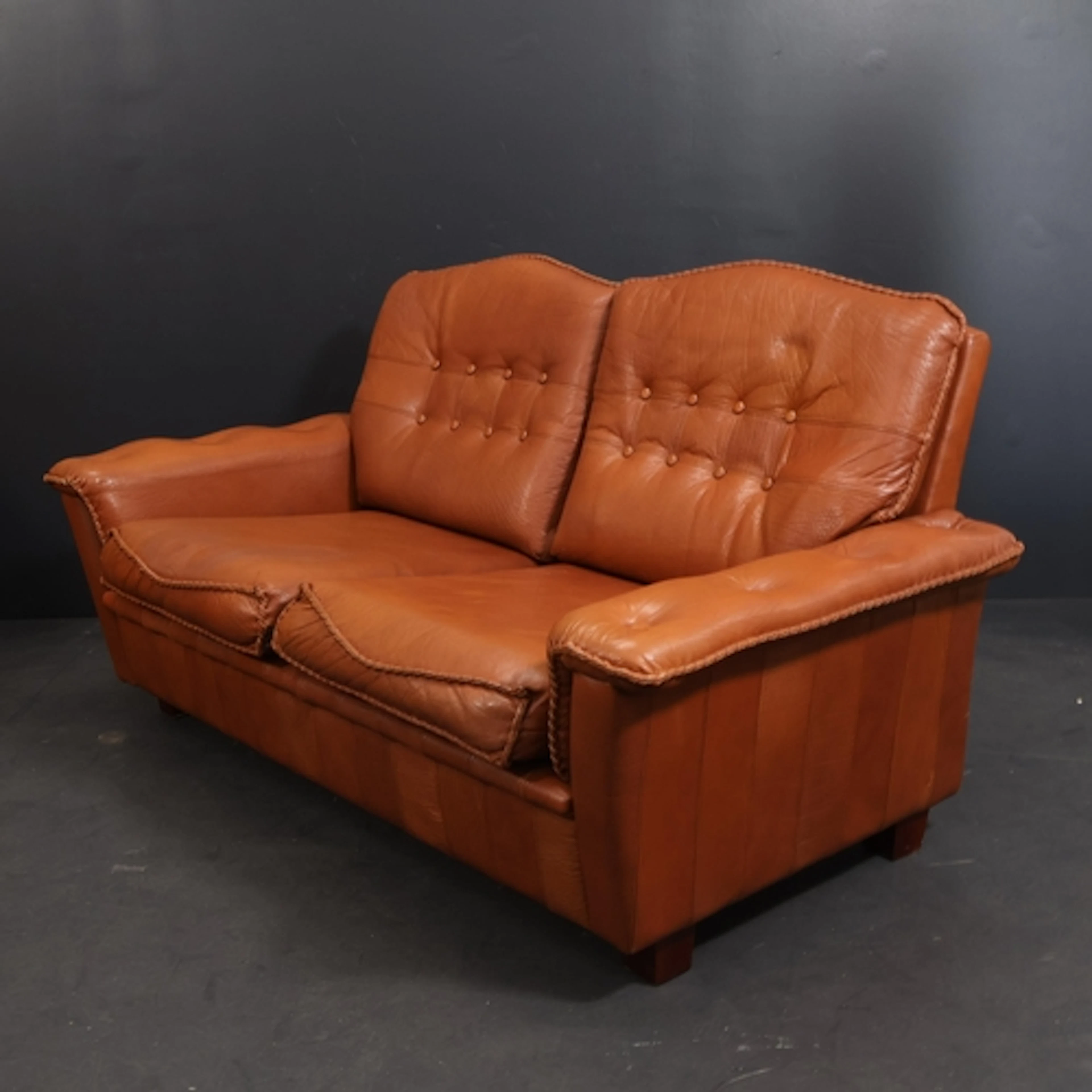 A Vintage brown buffalo leather Danish two-seater sofa by Ma...