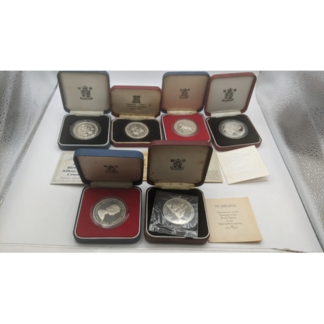 A group of six Royal Family related boxed commemorative coin...