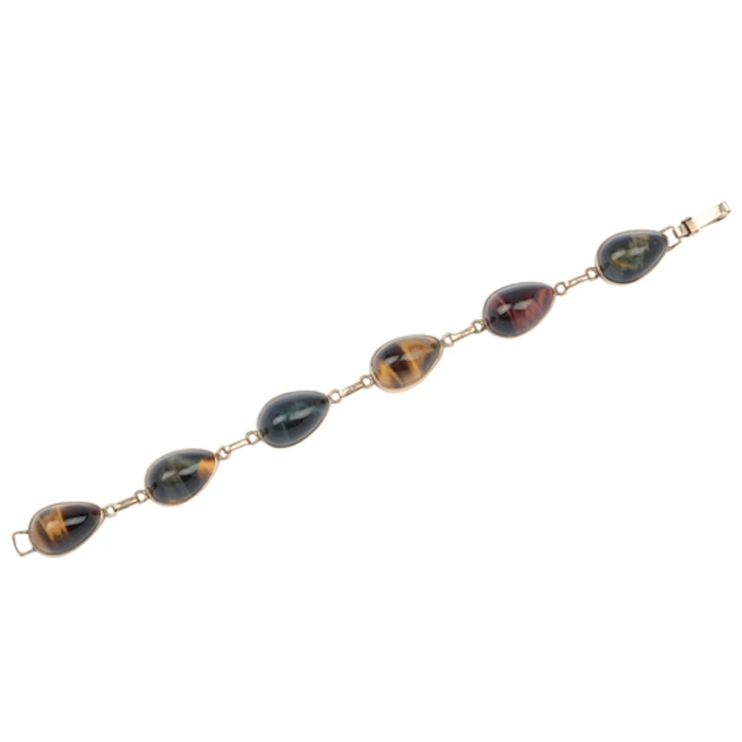A tiger's eye bracelet, 1970s, composed of collet-set pear-s...