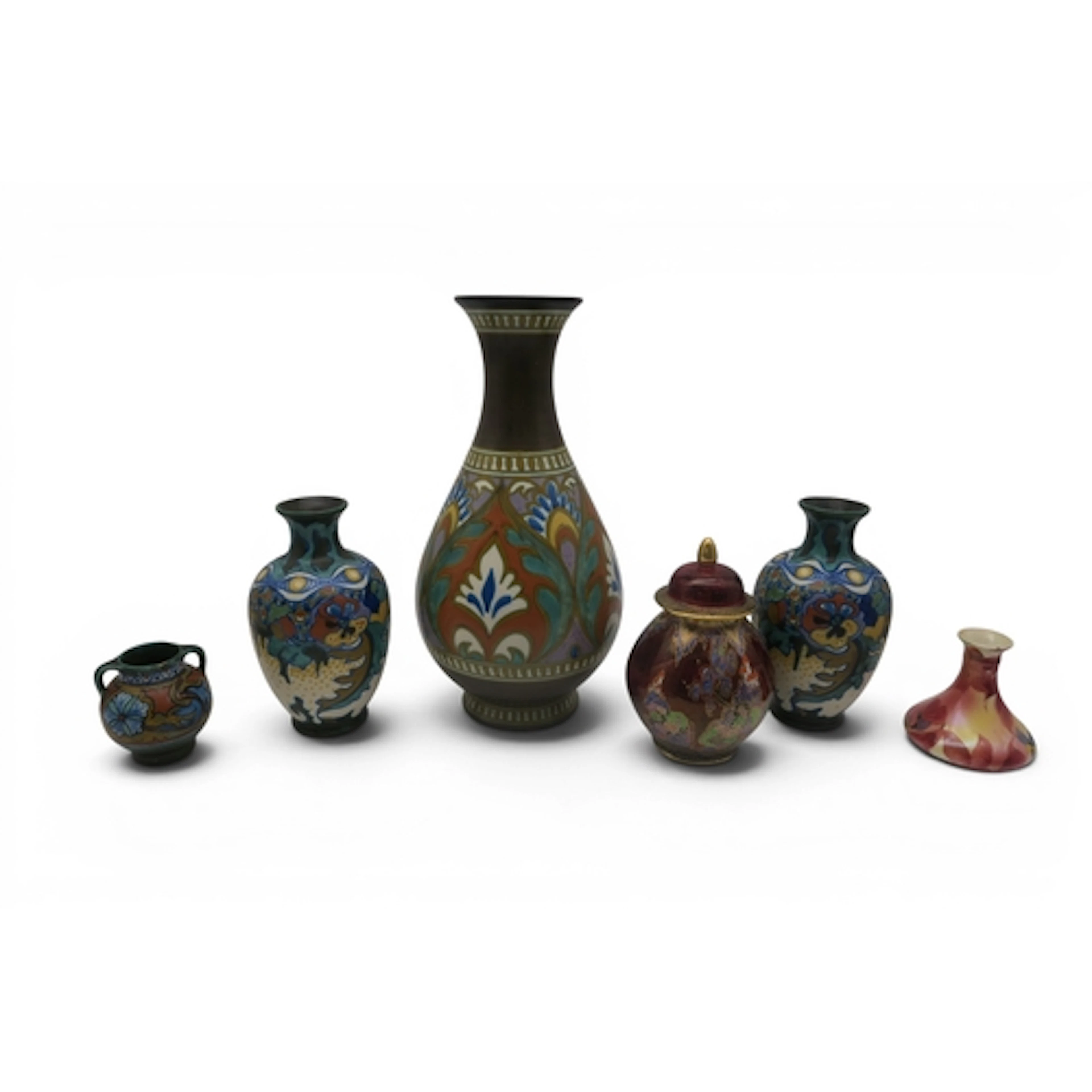A pair of Gouda Corona pattern vases, two other Gouda vases,...