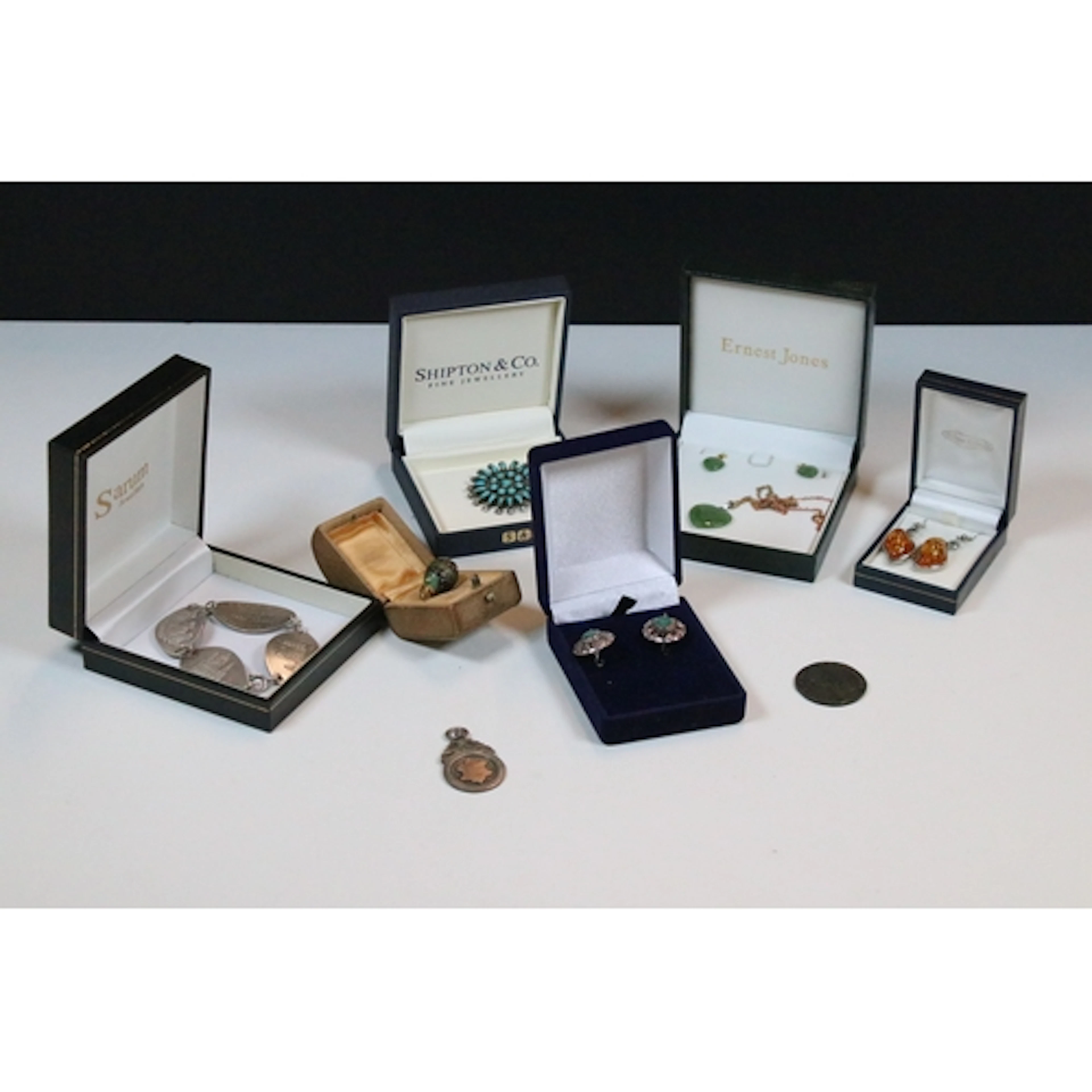 Sterling silver bracelet having panels featuring British lan...